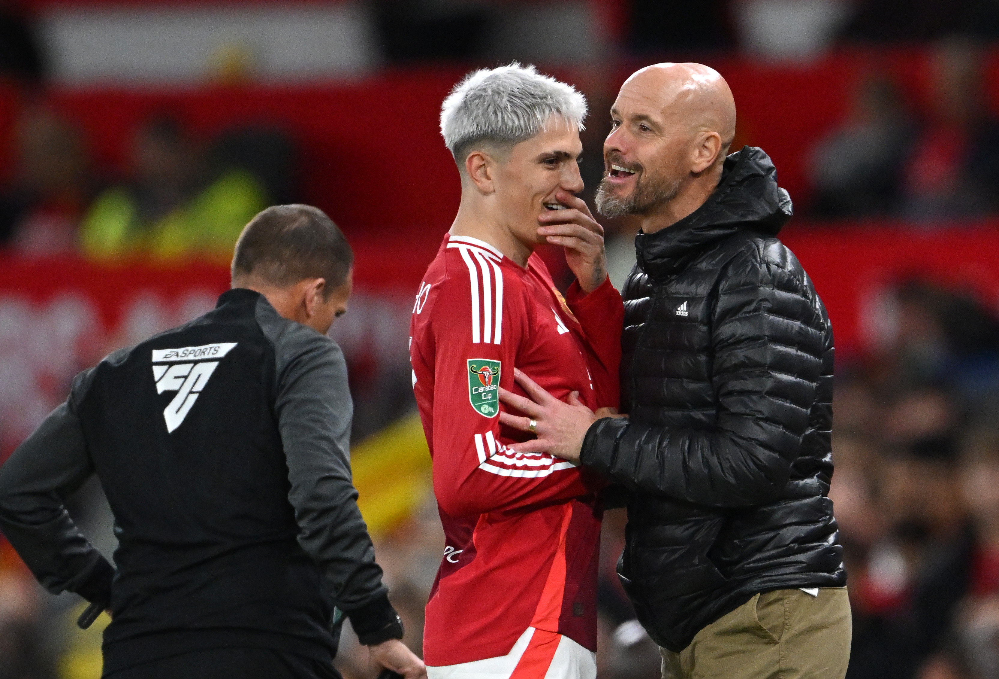 Alejandro Garnacho chats with Erik ten Hag on the touchline.