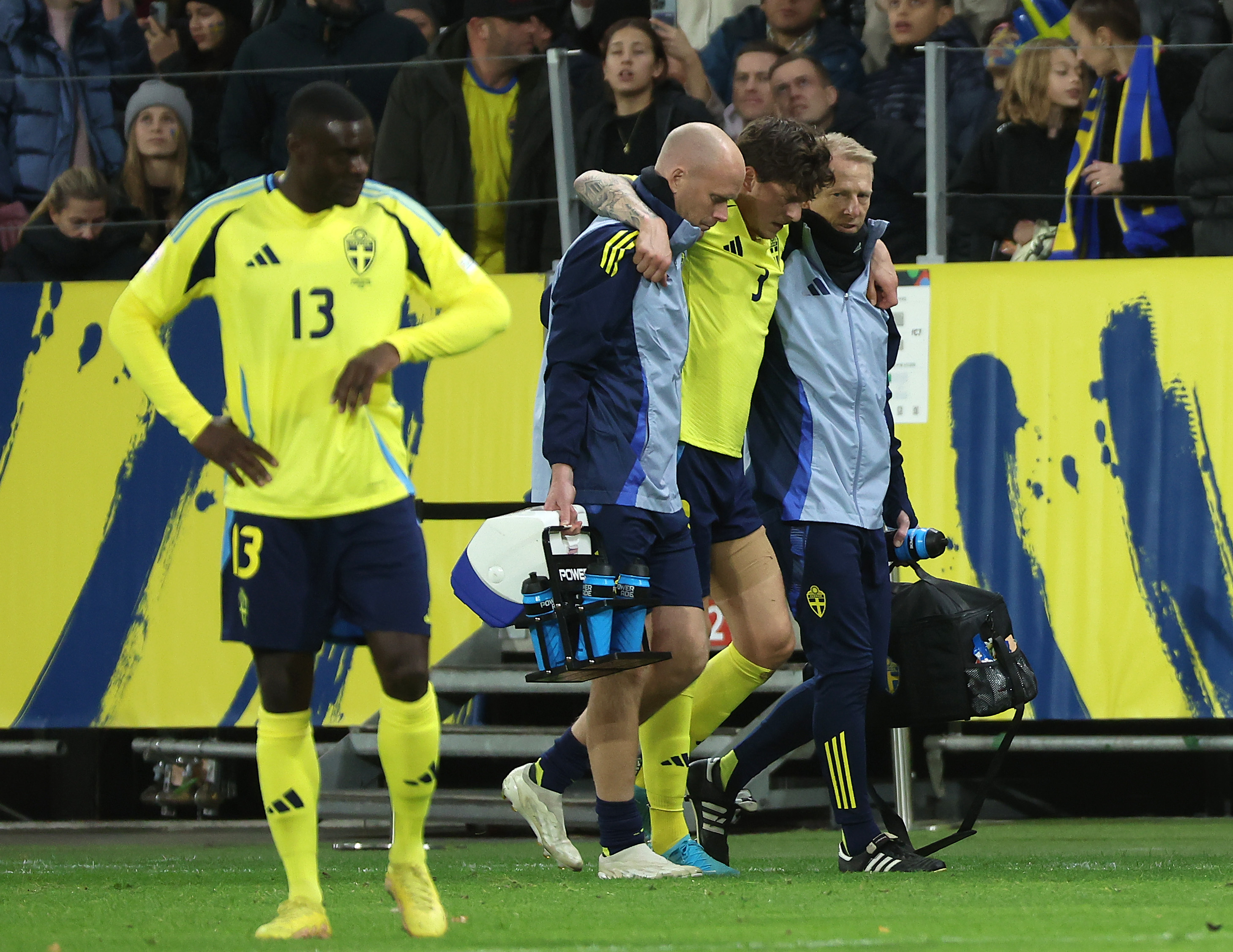 Victor Lindelof limps off during Sweden’s clash with Slovakia.