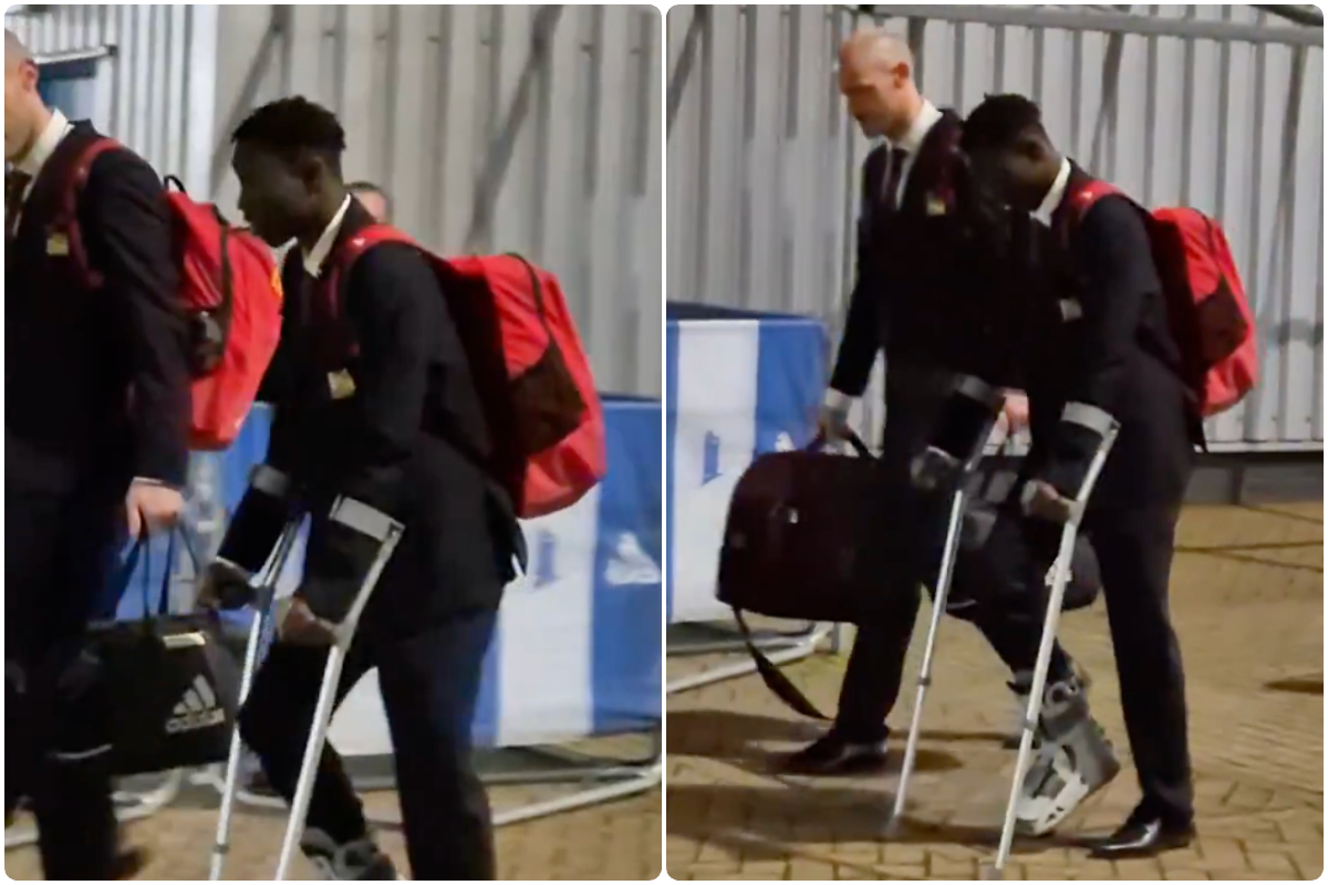 Sekou Kone on crutches and wearing a protective boot