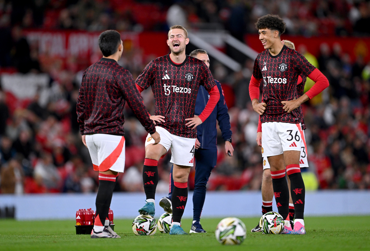 Ethan Wheatley interacts with Matthijs de Ligt and Lisandro Martinez.