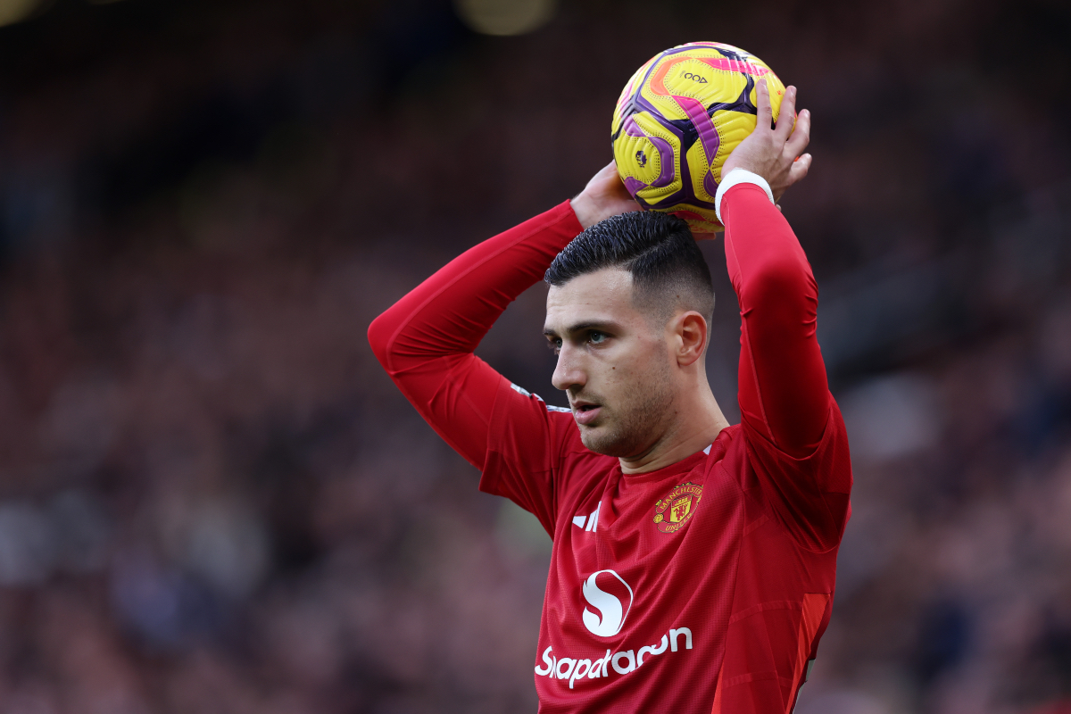 Diogo Dalot takes a throw-in.