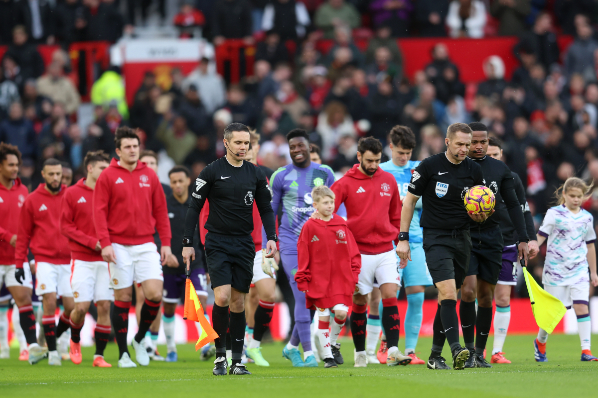 Manchester United players walk out at Old Trafford.