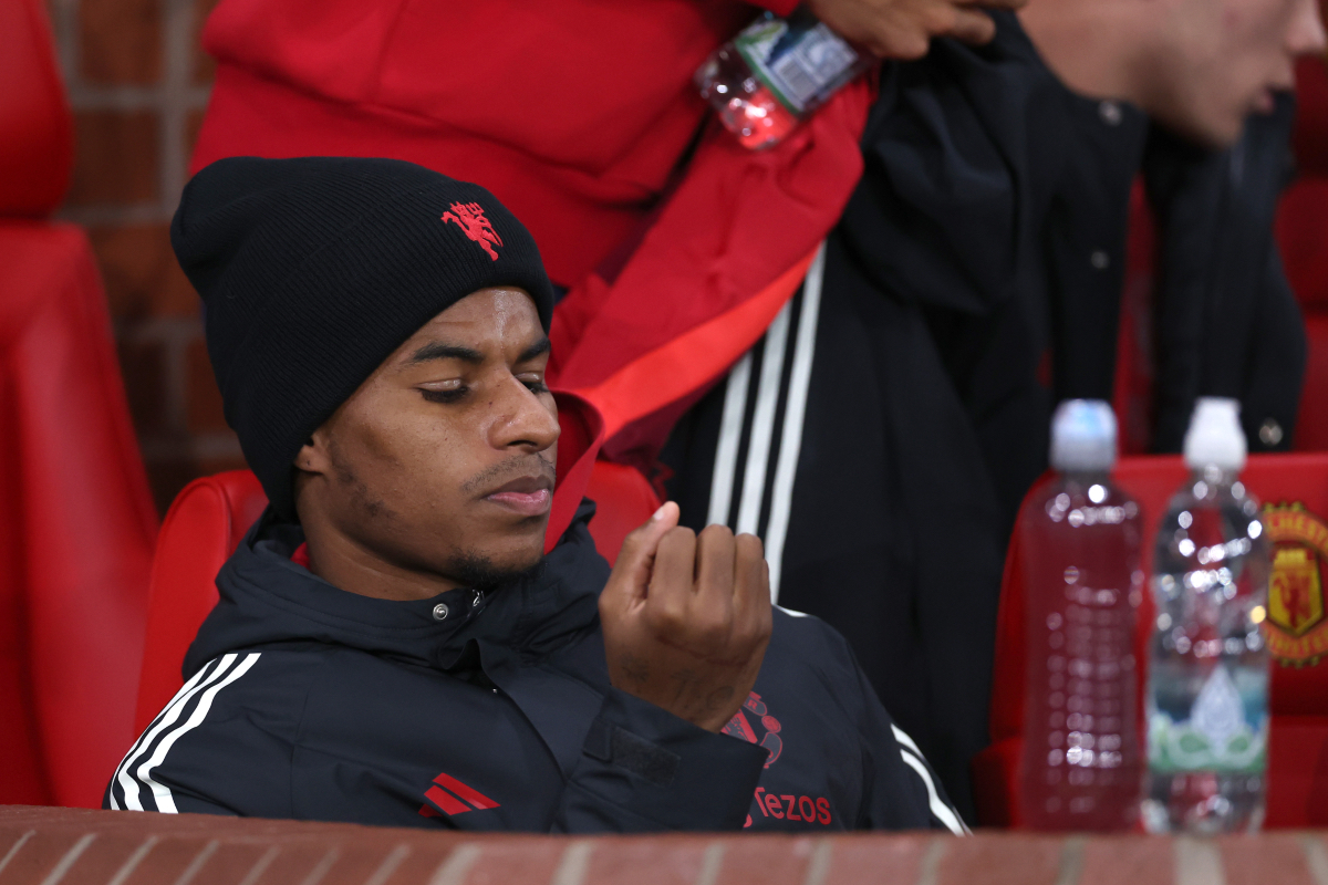 Marcus Rashford sits on the bench after being dropped by Ruben Amorim.