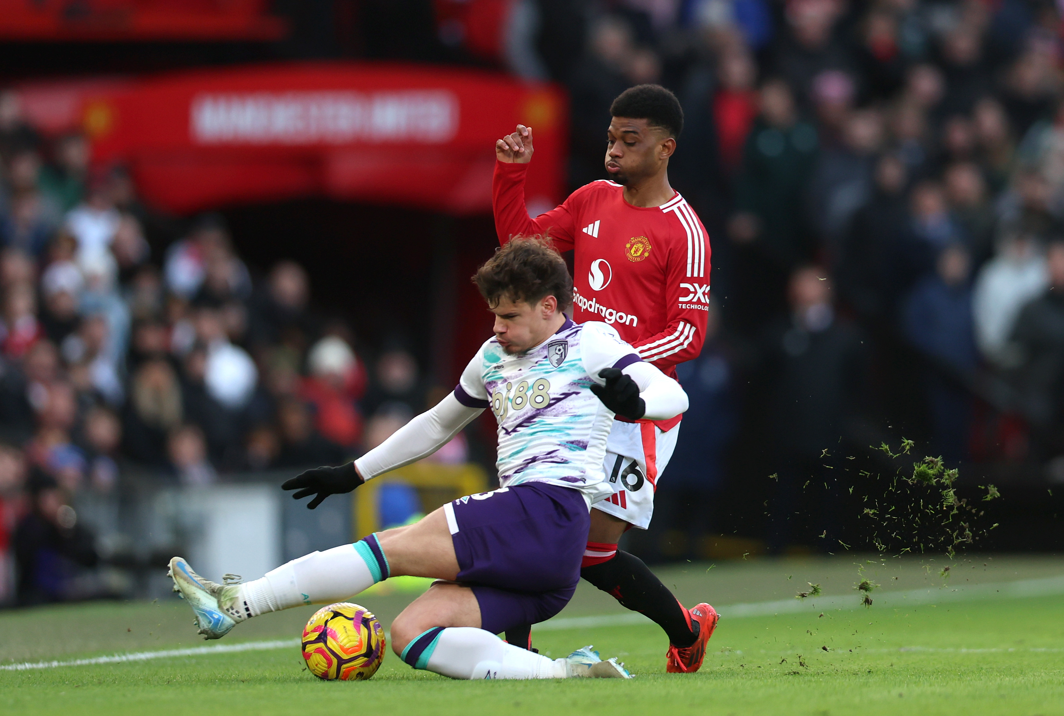 Milos Kerkez vies with Amad Diallo at Old Trafford in December.