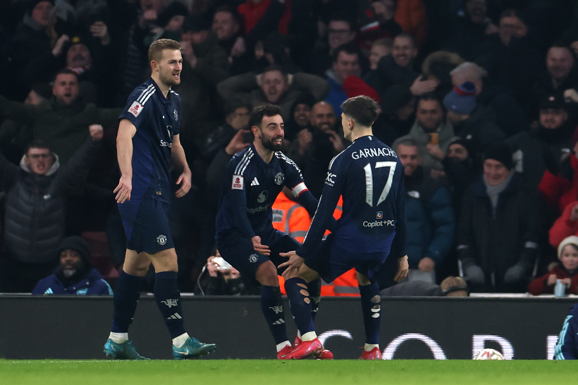 Fernandes and Garnacho celebrate after combining for United’s first goal against Arsenal