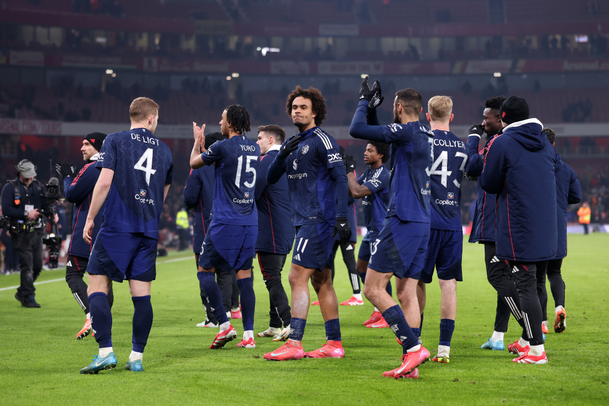 Joshua Zirkzee gestures to Man United fans after scoring the winning penalty in the shootout vs Arsenal.