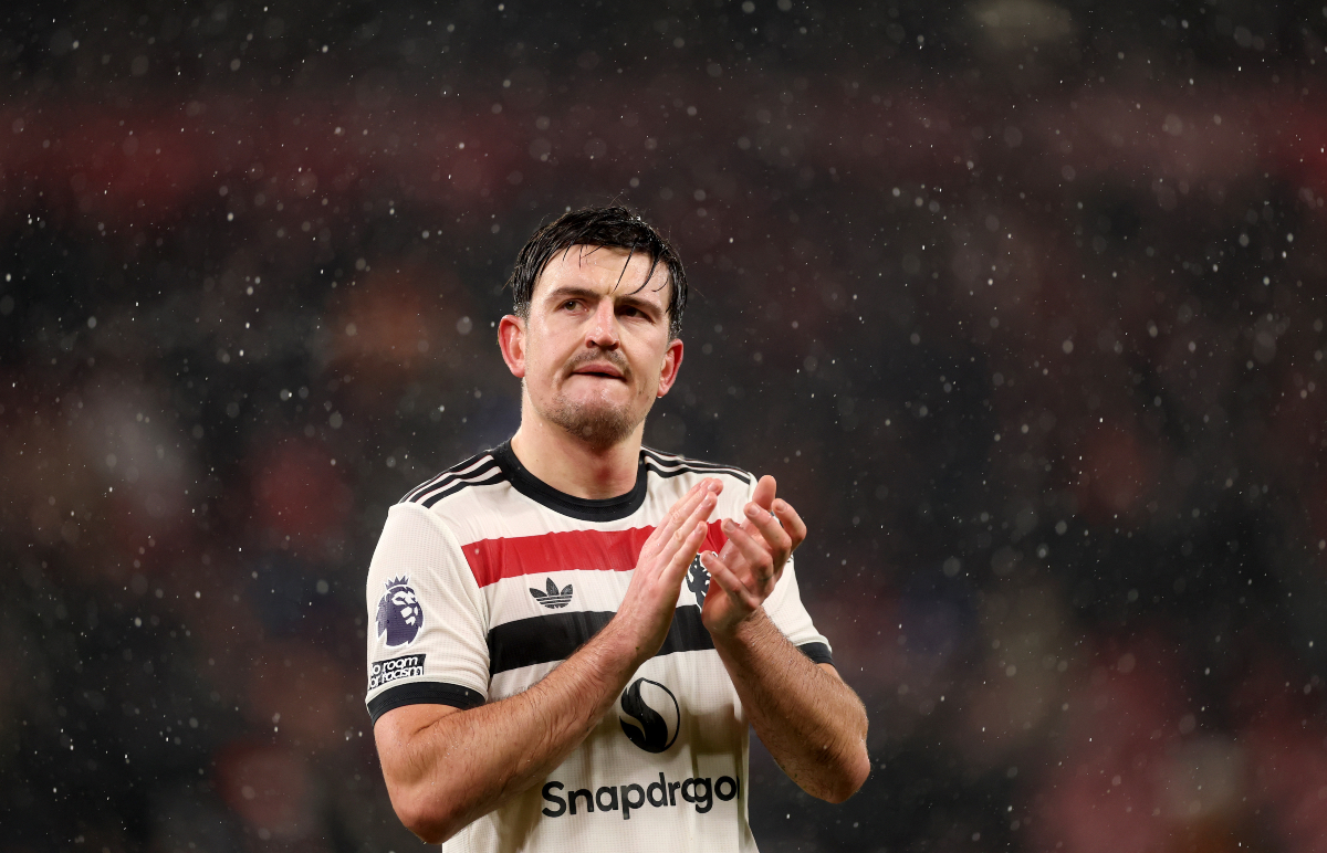 Harry Maguire applauds the travelling Man United fans at Anfield.