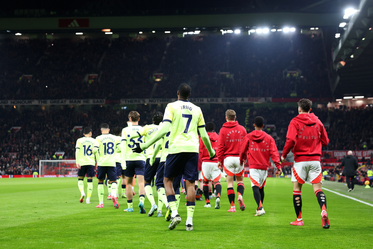 Manchester United players walk out of the tunnel at Old Trafford.