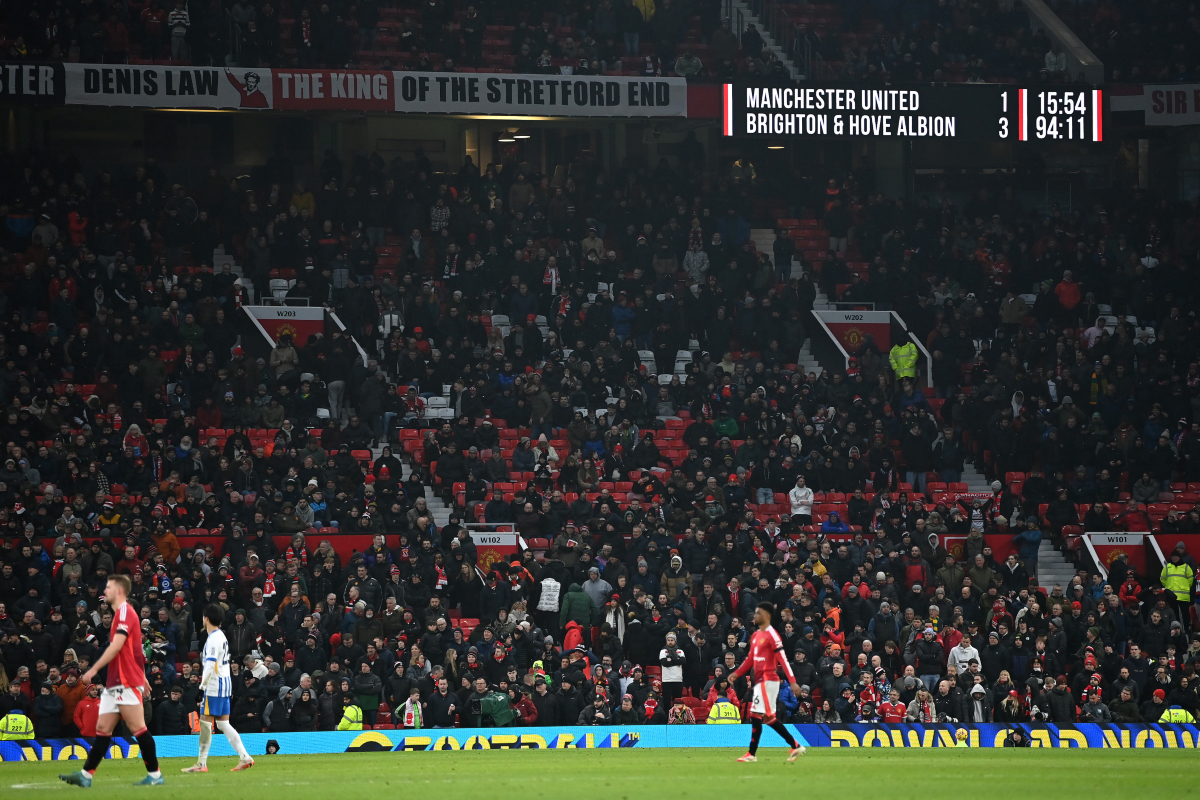 The Old Trafford scoreboard shows Manchester United losing 3-1 to Brighton.