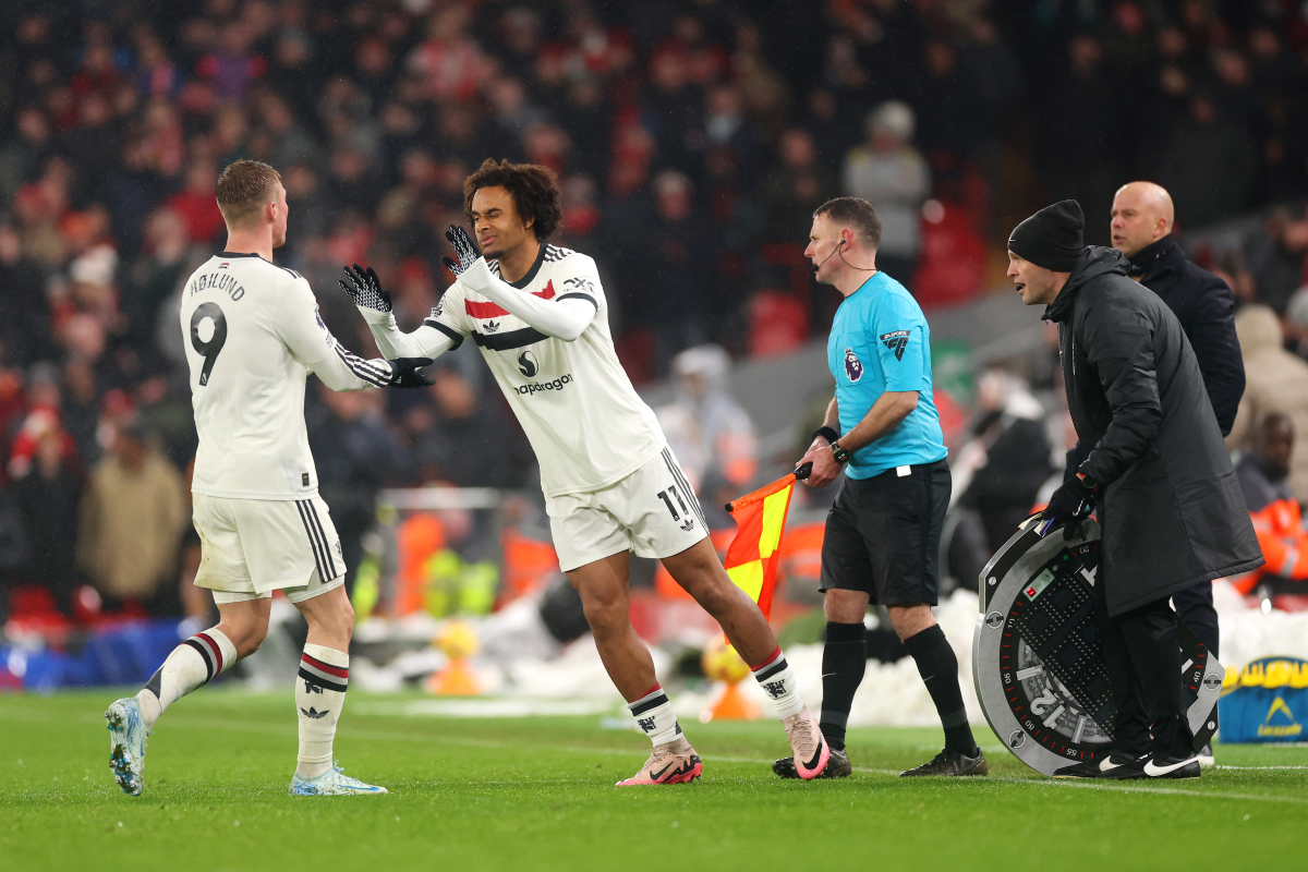 Joshua Zirkzee interacts with Rasmus Hojlund as he replaces him at Anfield. 