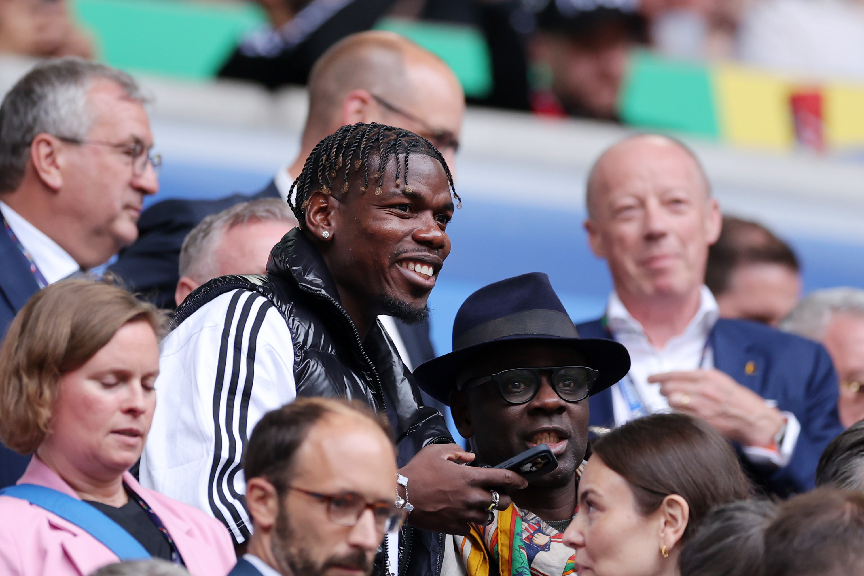 Paul Pogba all smiles in the stands