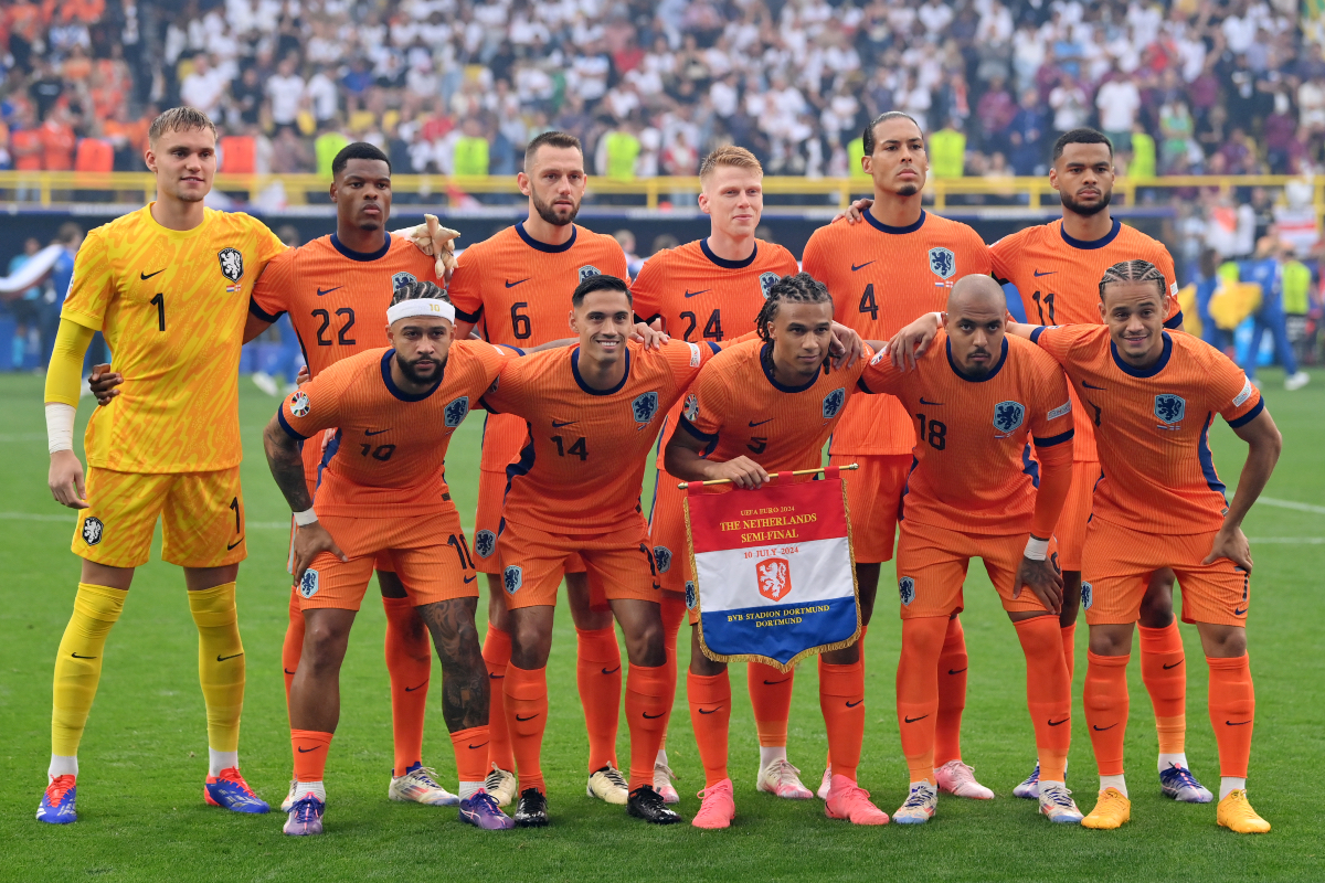 Cody Gakpo poses for a team picture with the Netherlands starting XI in the Euro 2024 semi-final.