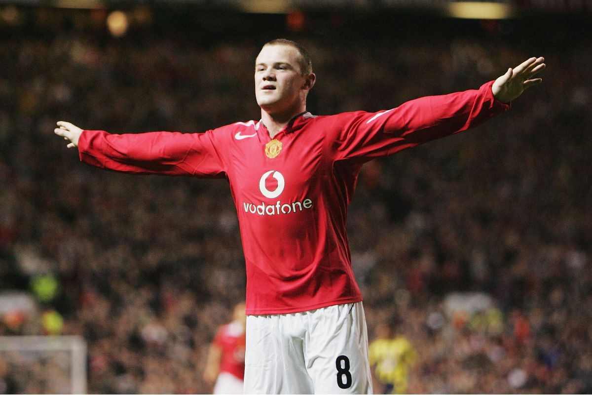 Wayne Rooney celebrates after scoring on his Man Utd debut.