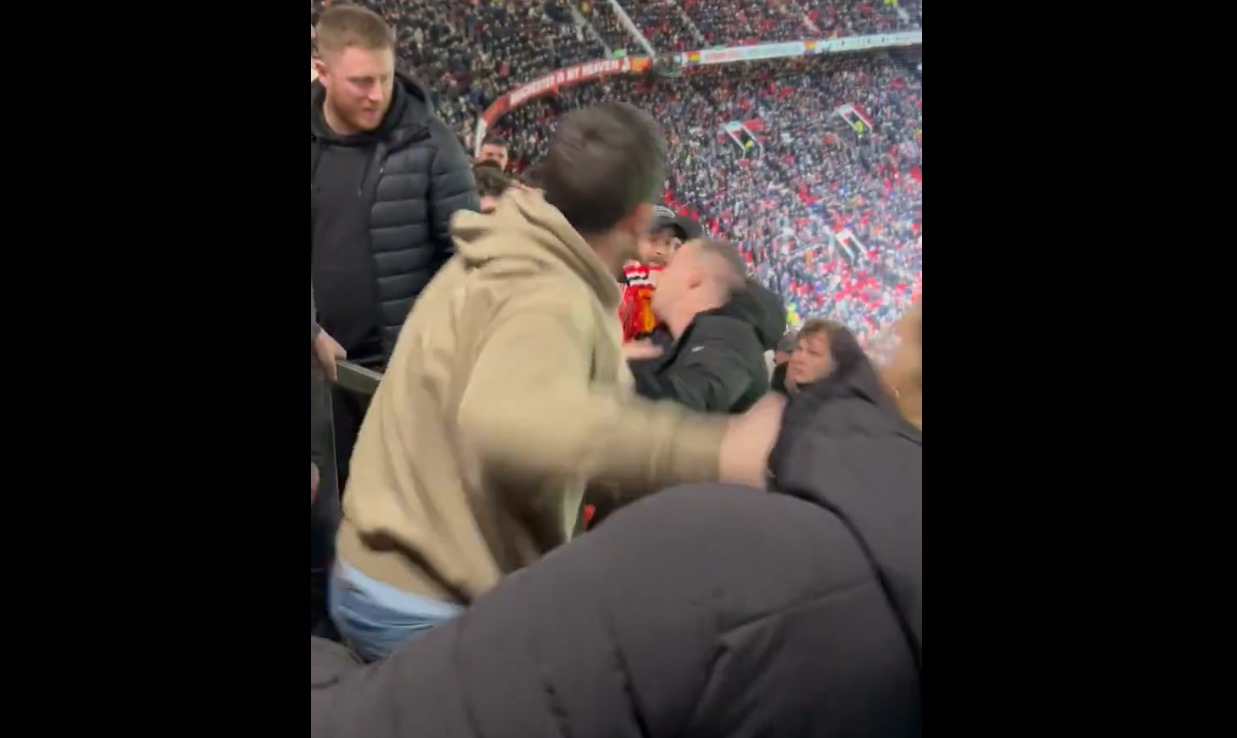 Man Utd fan aims punch at Rangers intruder