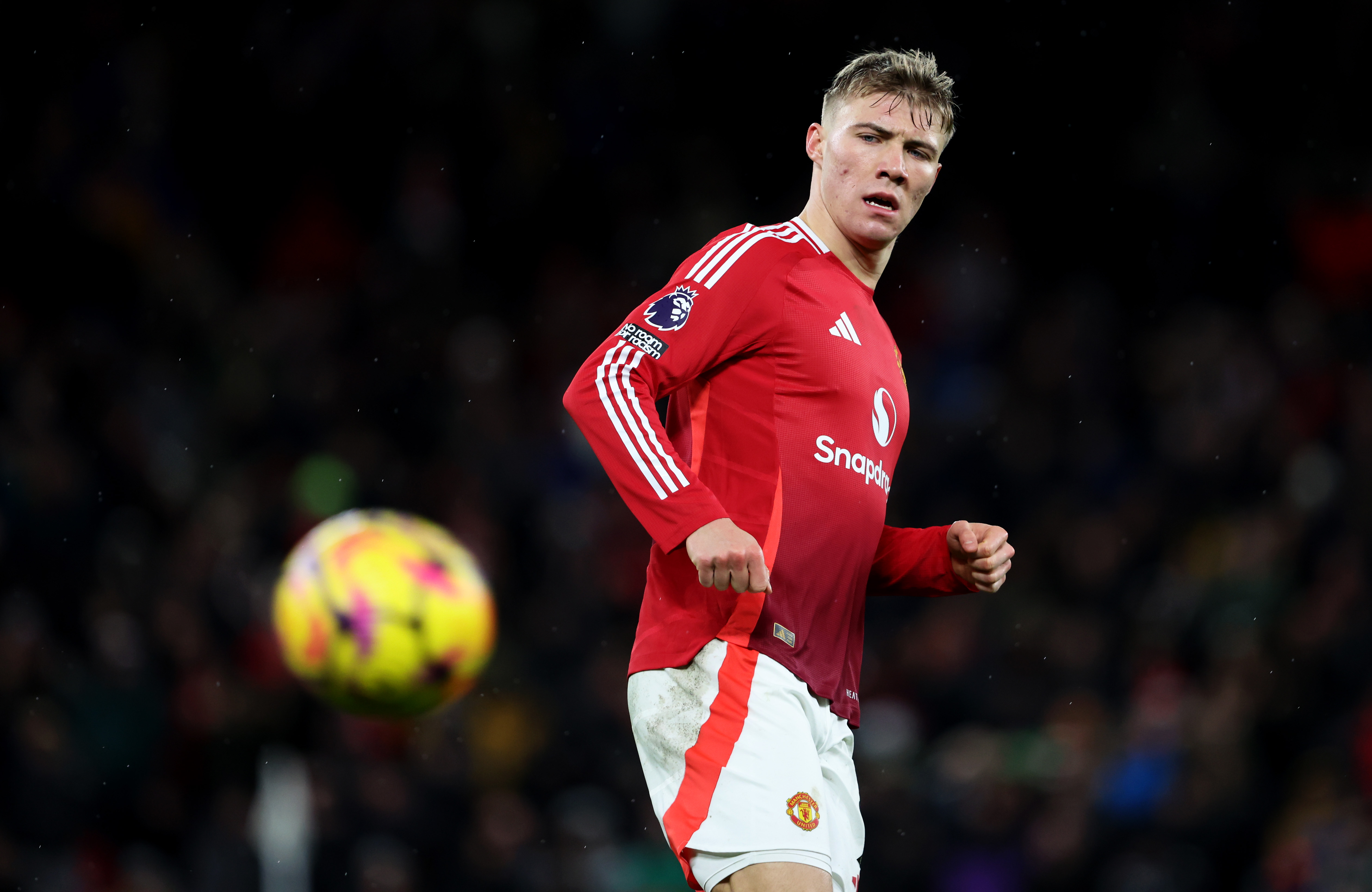 Rasmus Hojlund looks on after passing the ball while in action for Manchester United.