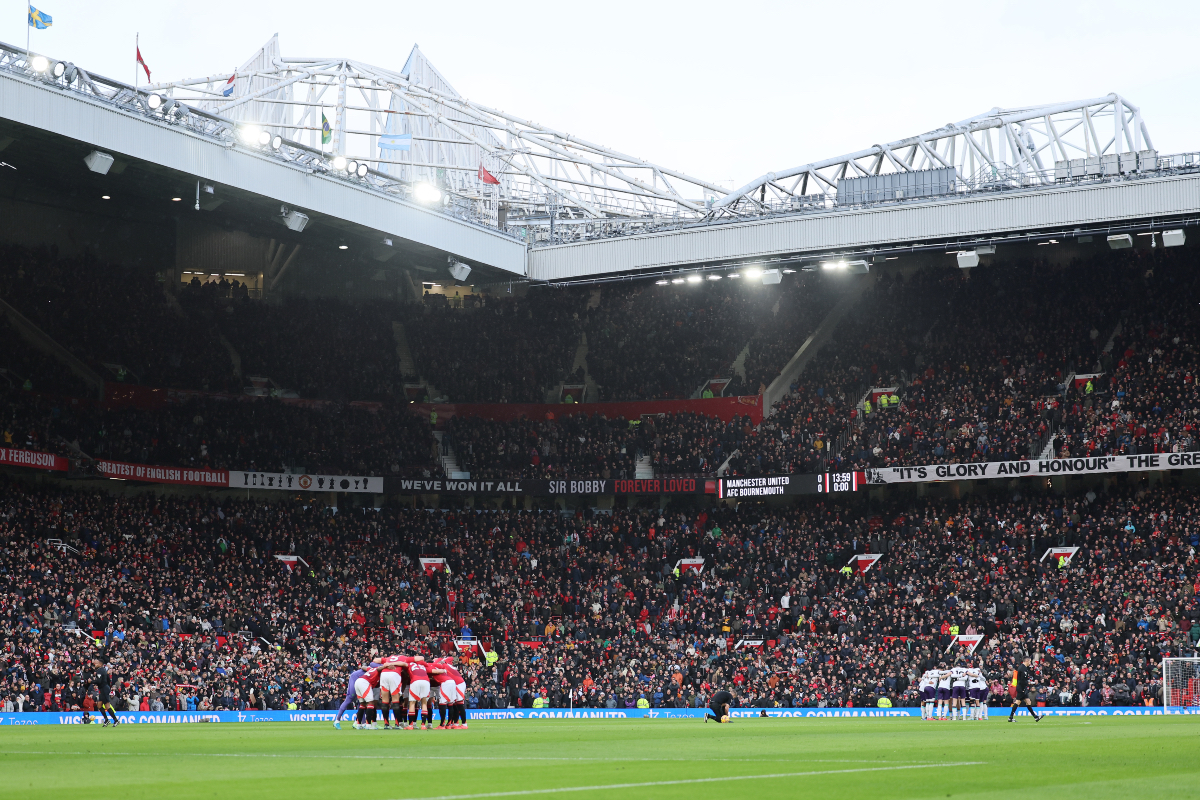 Manchester United players huddle ahead of kick-off at Old Trafford.