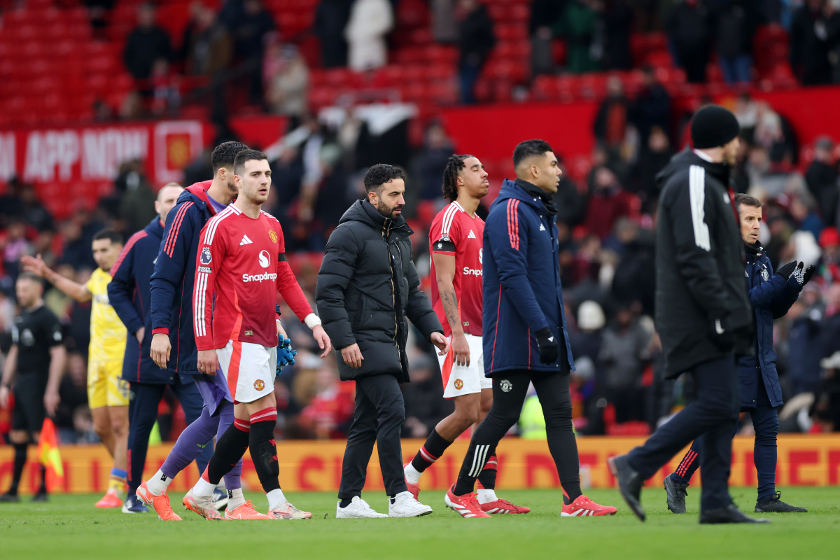 Ruben Amorim walks off the pitch with Diogo Dalot and Leny Yoro after losing to Crystal Palace.