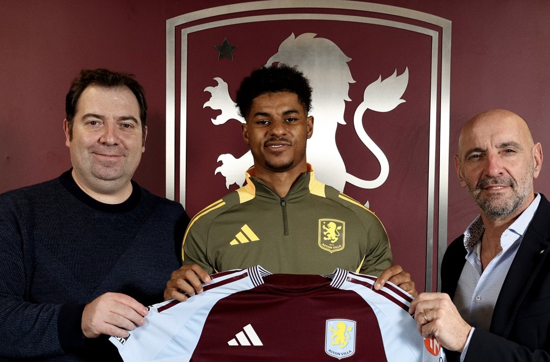 Marcus Rashford poses with his Aston Villa shirt after signing on loan.