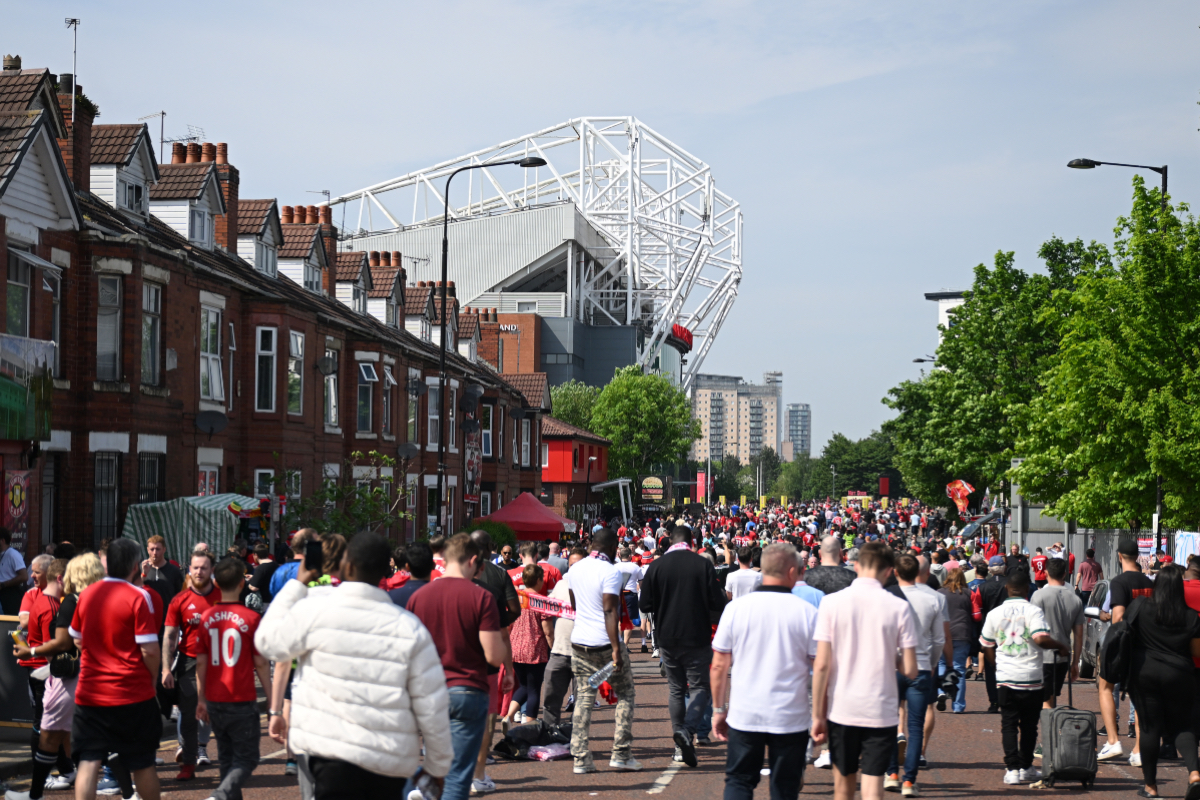 A general view of Manchester United fans walking towards Old Trafford on matchday.