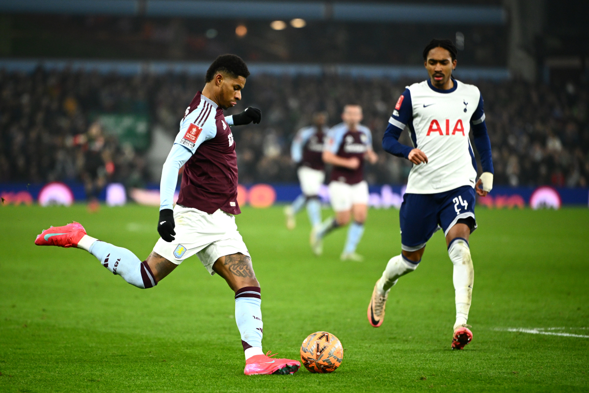 Marcus Rashford attempts to cross the ball while under pressure from Djed Spence.