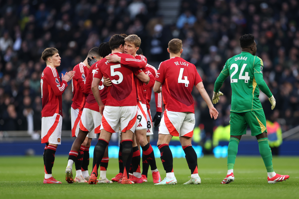 LONDON, ENGLAND - FEBRUARY 16: Harry Maguire and Rasmus Hojlund of Manchester United embrace after a team huddle prior to kick-off ahead of the Premier League match between Tottenham Hotspur FC and Manchester United FC at Tottenham Hotspur Stadium on February 16, 2025 in London, England