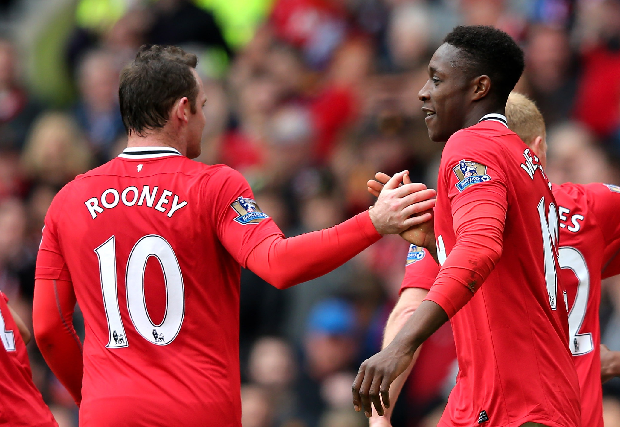 MANCHESTER, ENGLAND - APRIL 15: Danny Welbeck of Manchester United celebrates scoring his team's second goal with team mate Wayne Rooney during the Barclays Premier League match between Manchester United and Aston Villa at Old Trafford on April 15, 2012 in Manchester, England