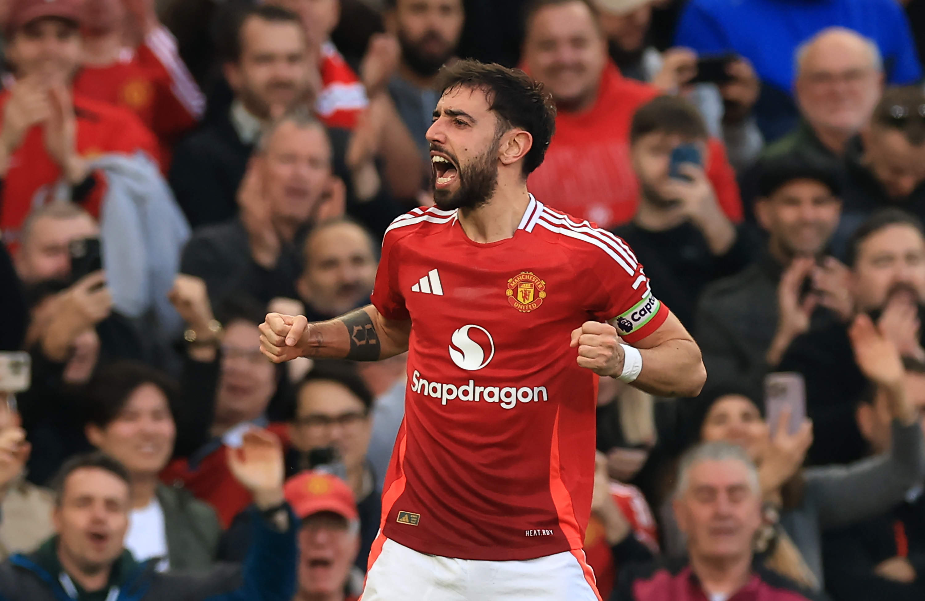 Bruno Fernandes celebrates after scoring a free-kick against Arsenal at Old Trafford.