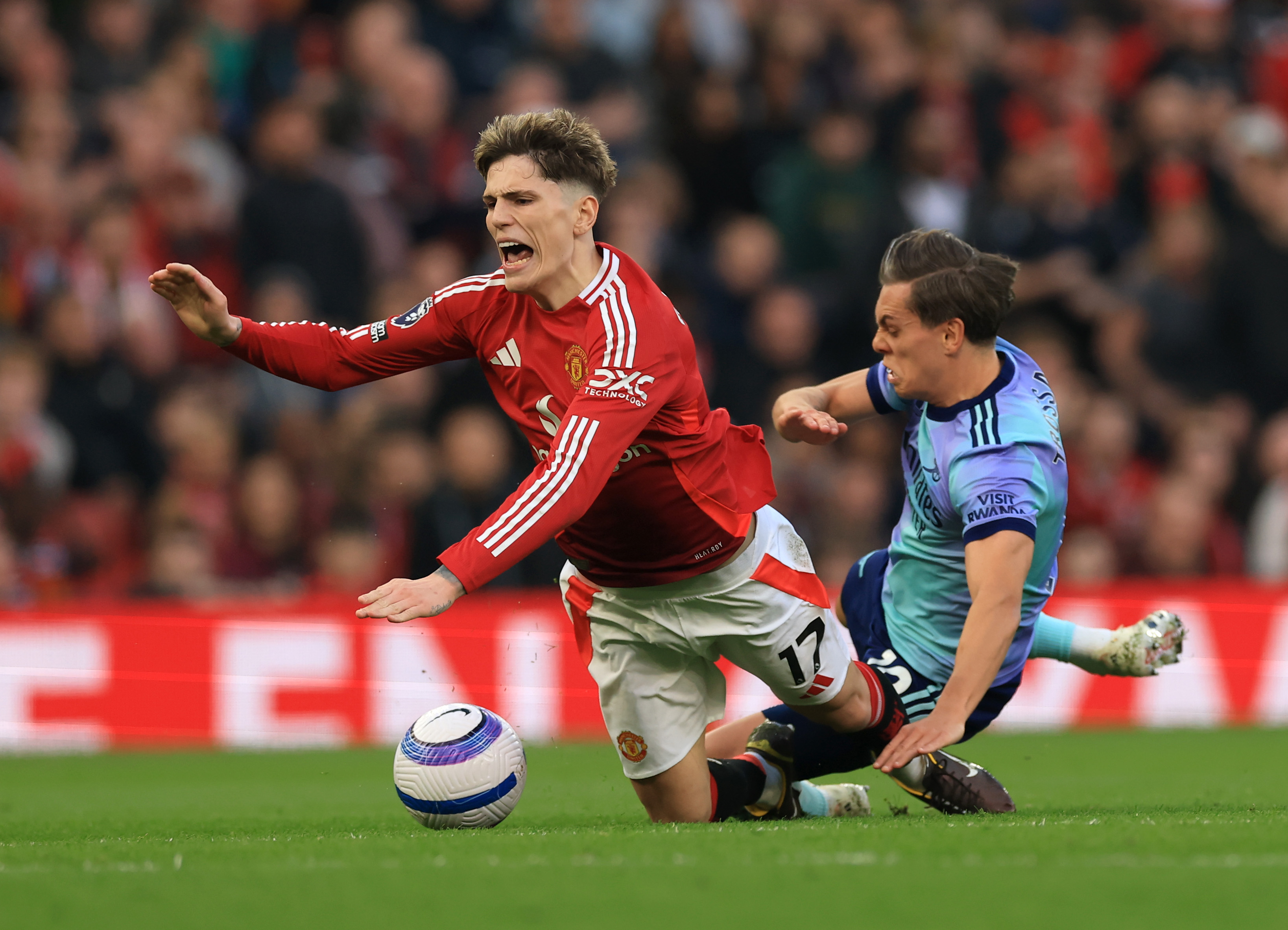 Alejandro Garnacho is fouled by Leandro Trossard.