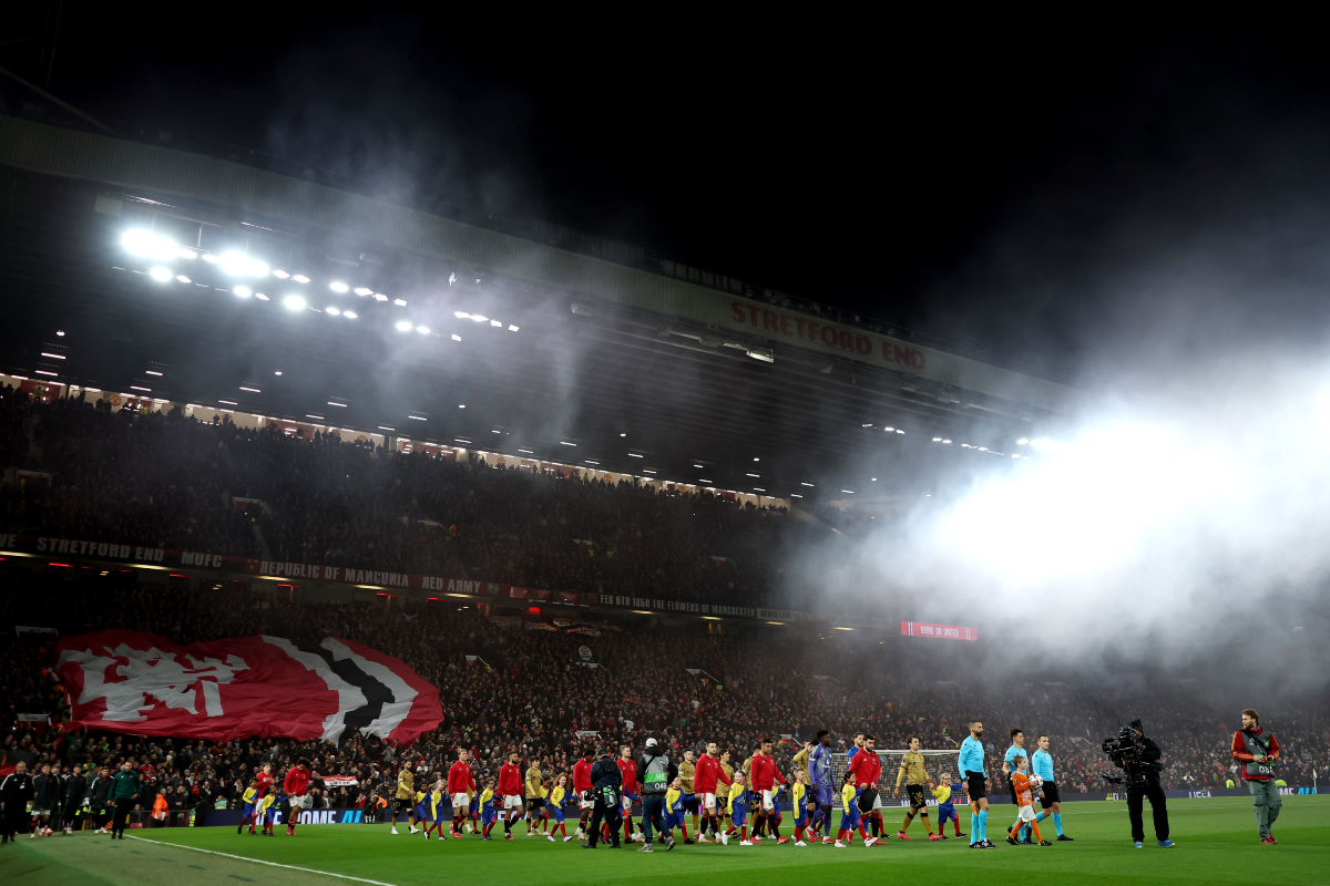 Manchester United and Real Sociedad players walk out of the tunnel at Old Trafford.