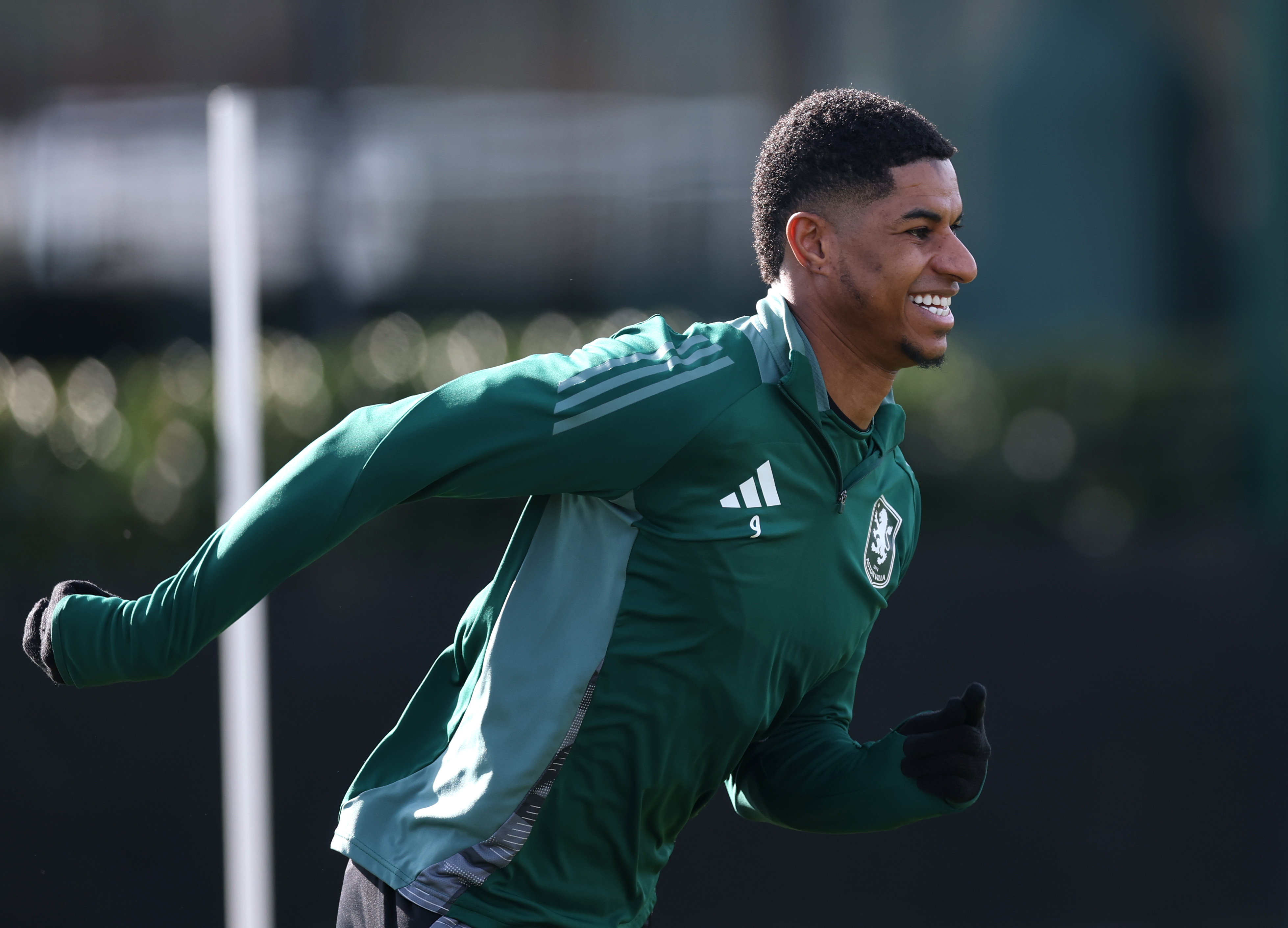 Marcus Rashford smiles in training for Aston Villa.