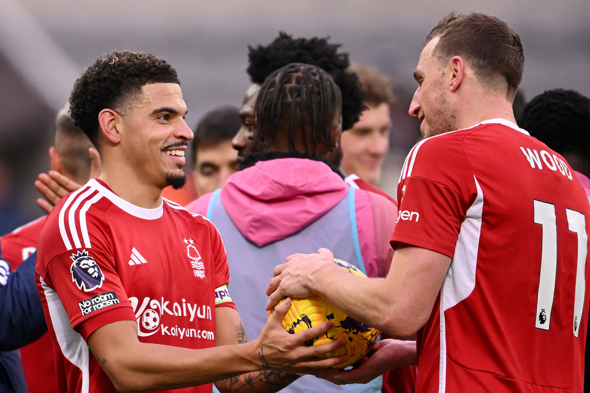 Morgan Gibbs-White hands Chris Wood the match ball after he scores a hat-trick against Newcastle.