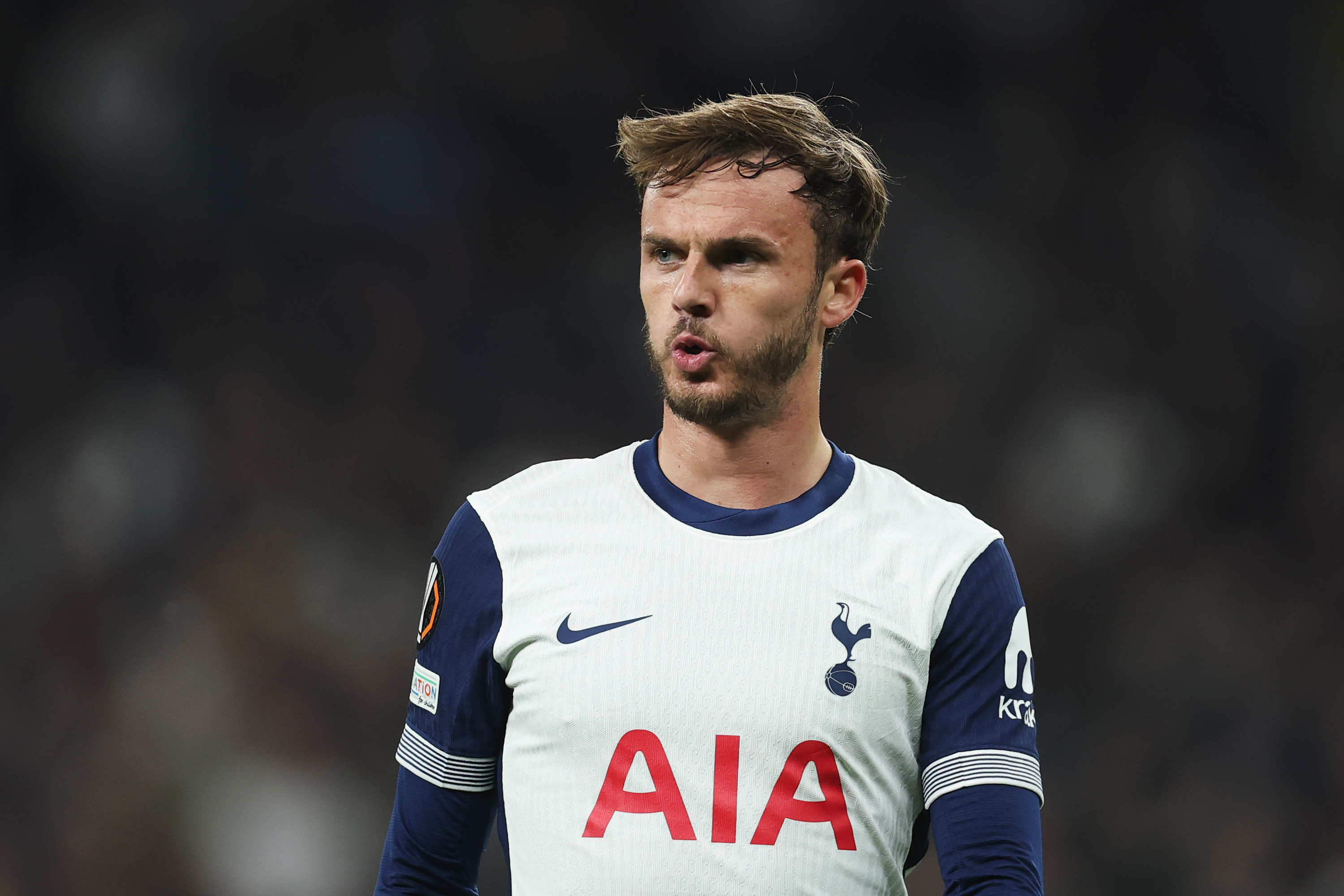 James Maddison puffs out his cheeks while in action for Spurs in the Europa League.