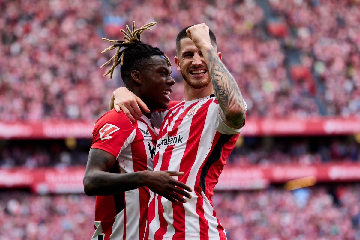 Oihan Sancet and Nico Williams embrace while celebrating a goal together.