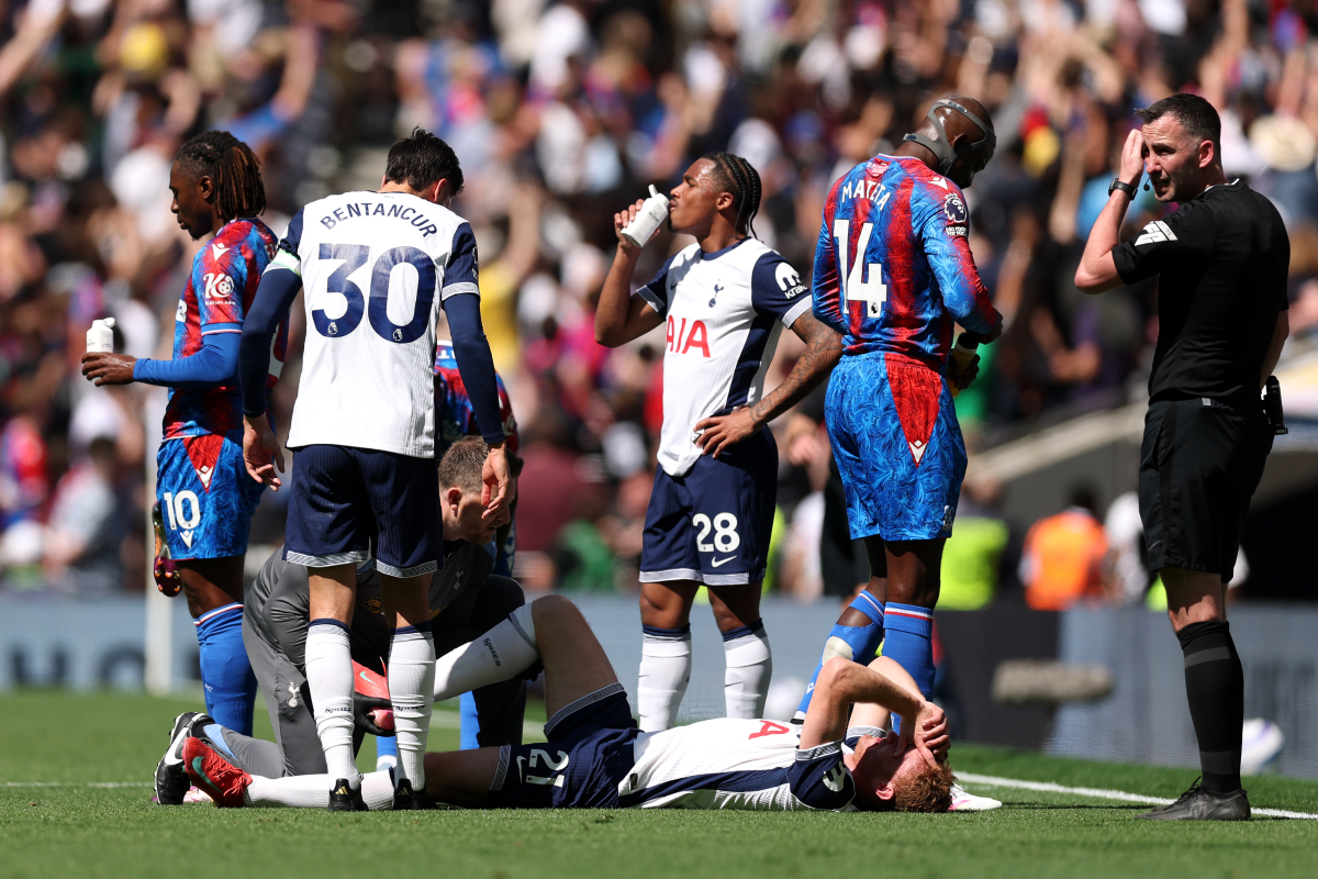 Dejan Kulusevski lays on the floor and receives treatment after sustaining an injury against Crystal Palace.