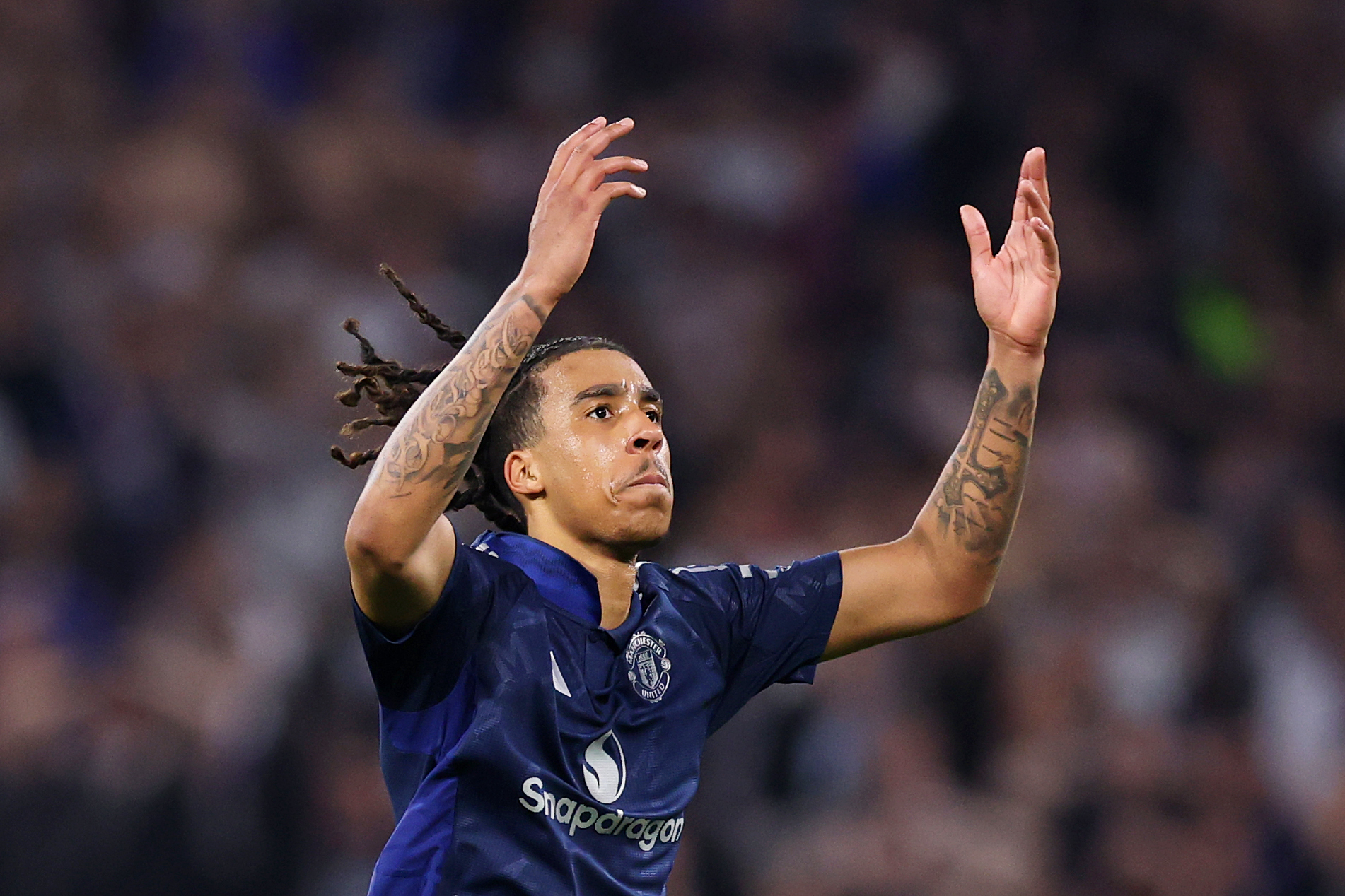 Leny Yoro rallies the Man United fans following his equaliser vs Lyon.