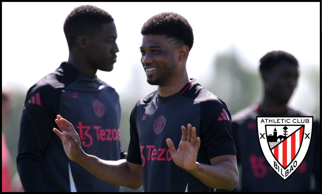 Amad smiles alongside Kobbie Mainoo in training at Carrington.