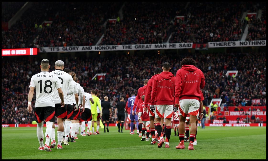 Manchester United players walk out of the tunnel at Old Trafford.