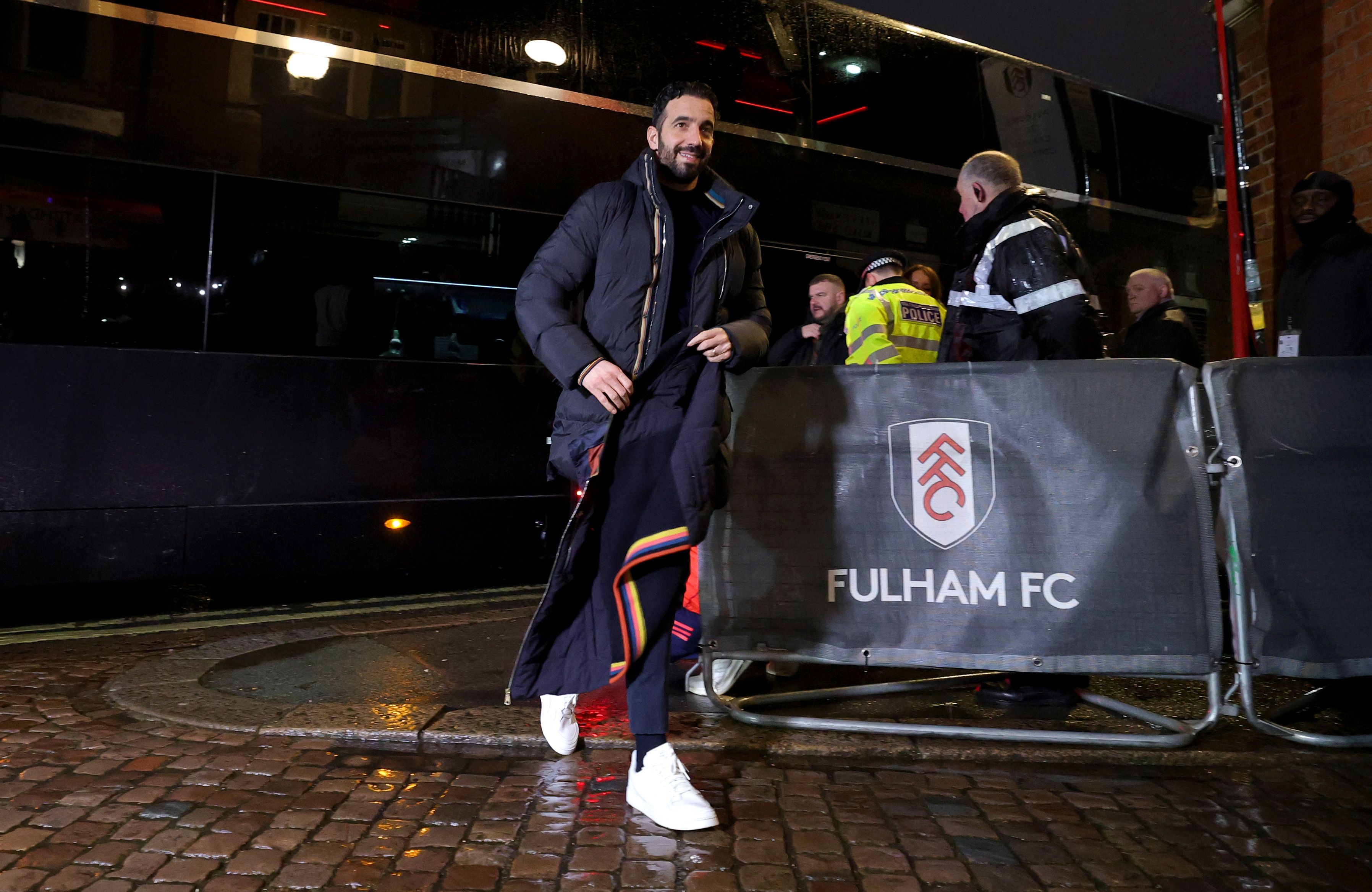 Ruben Amorim smiles for the cameras whilst arriving at Craven Cottage.