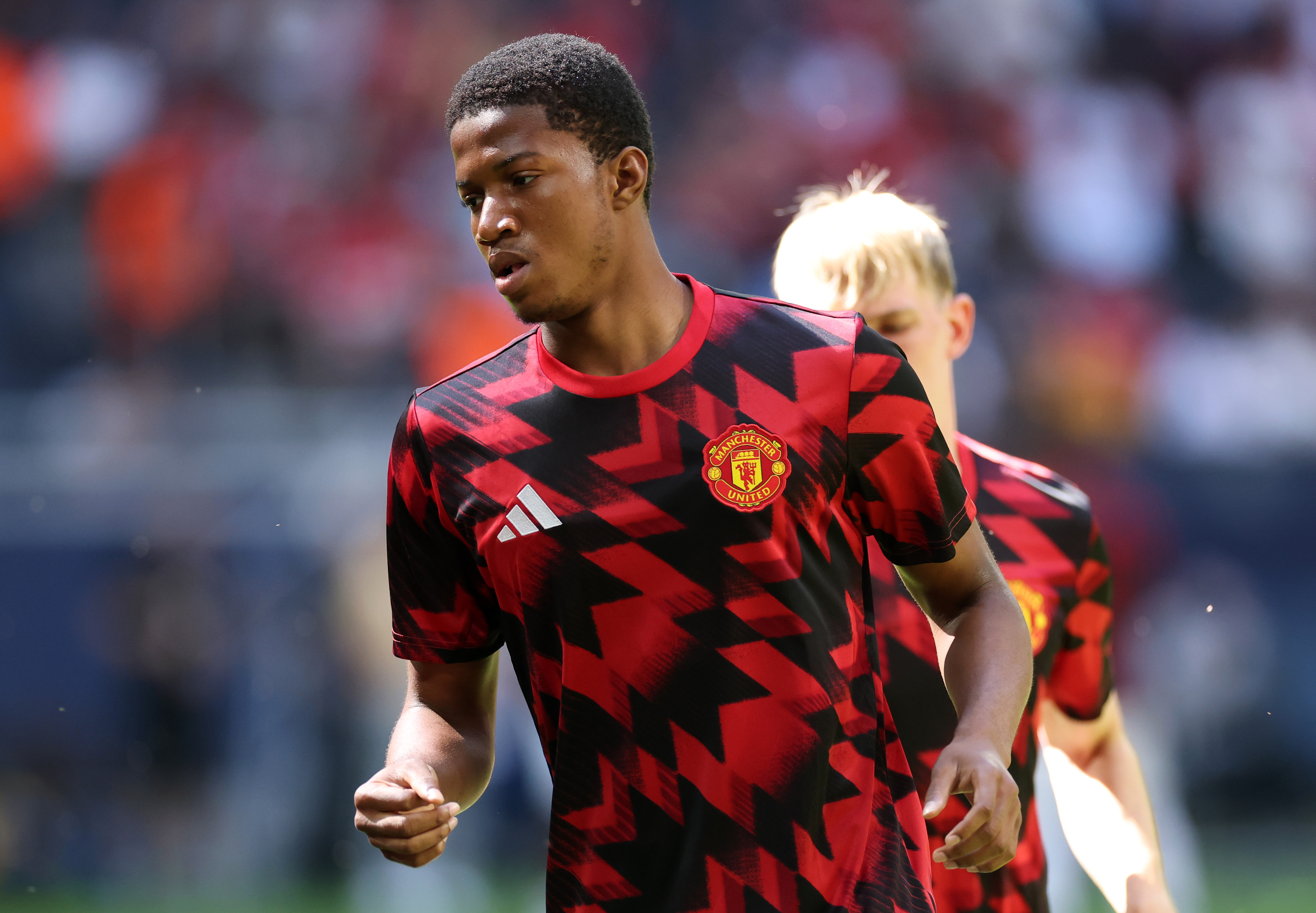 Chido Obi warms up before Man United face Leeds in Stockholm.