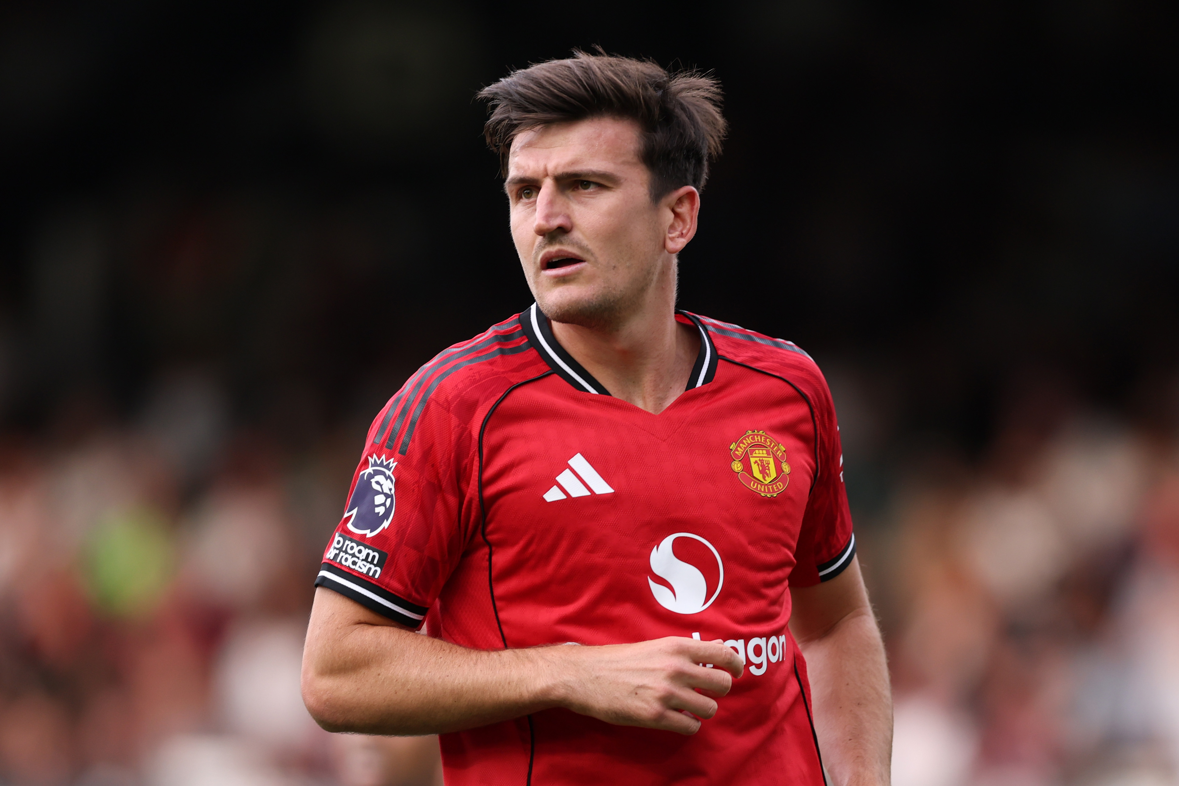 Harry Maguire looks on while in action for Man United.