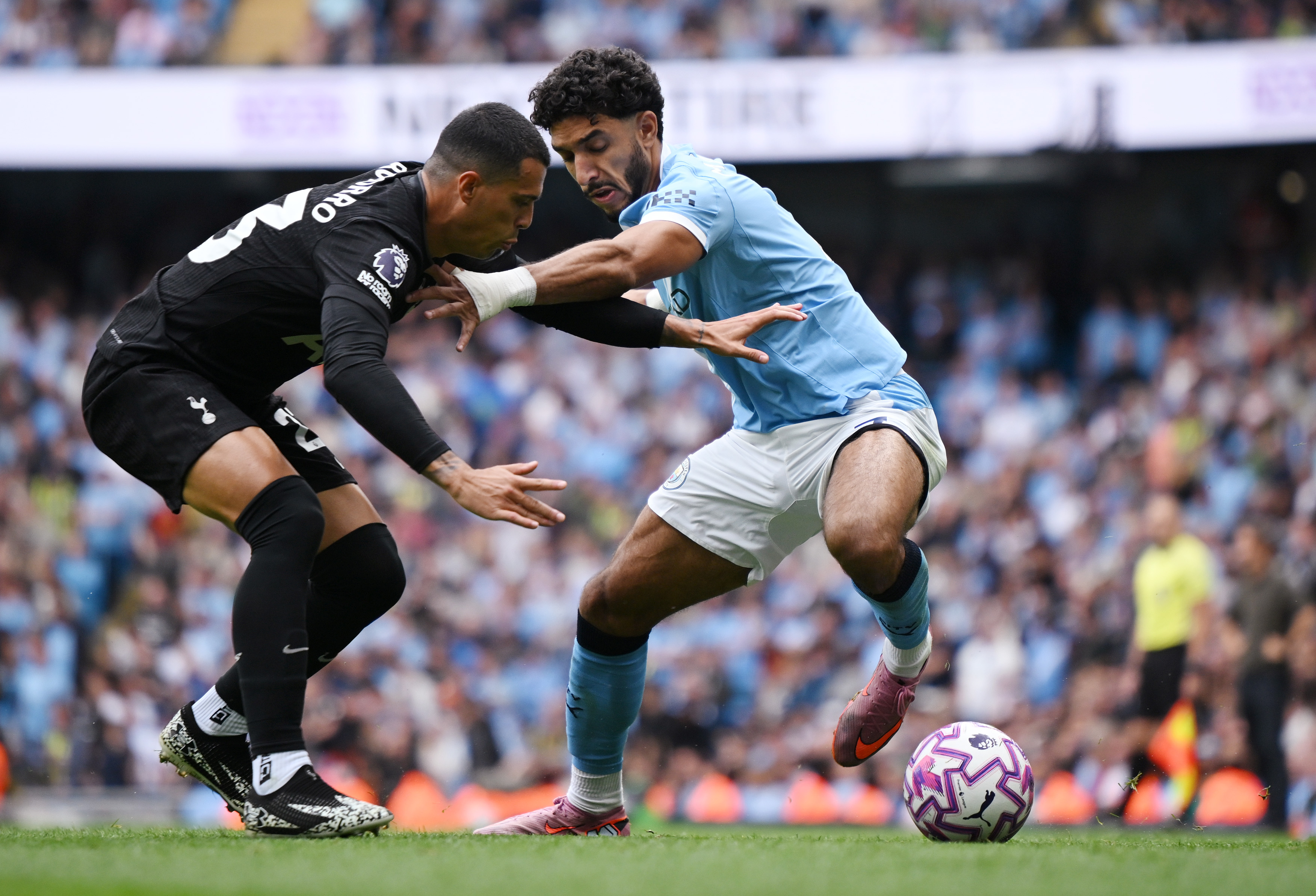 Omar Marmoush attempts to take on Pedro Porro.