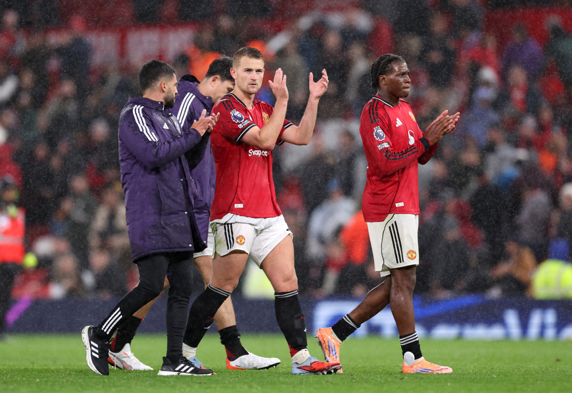 Patrick Dorgu and Matthijs de Ligt applaud the Man United fans.