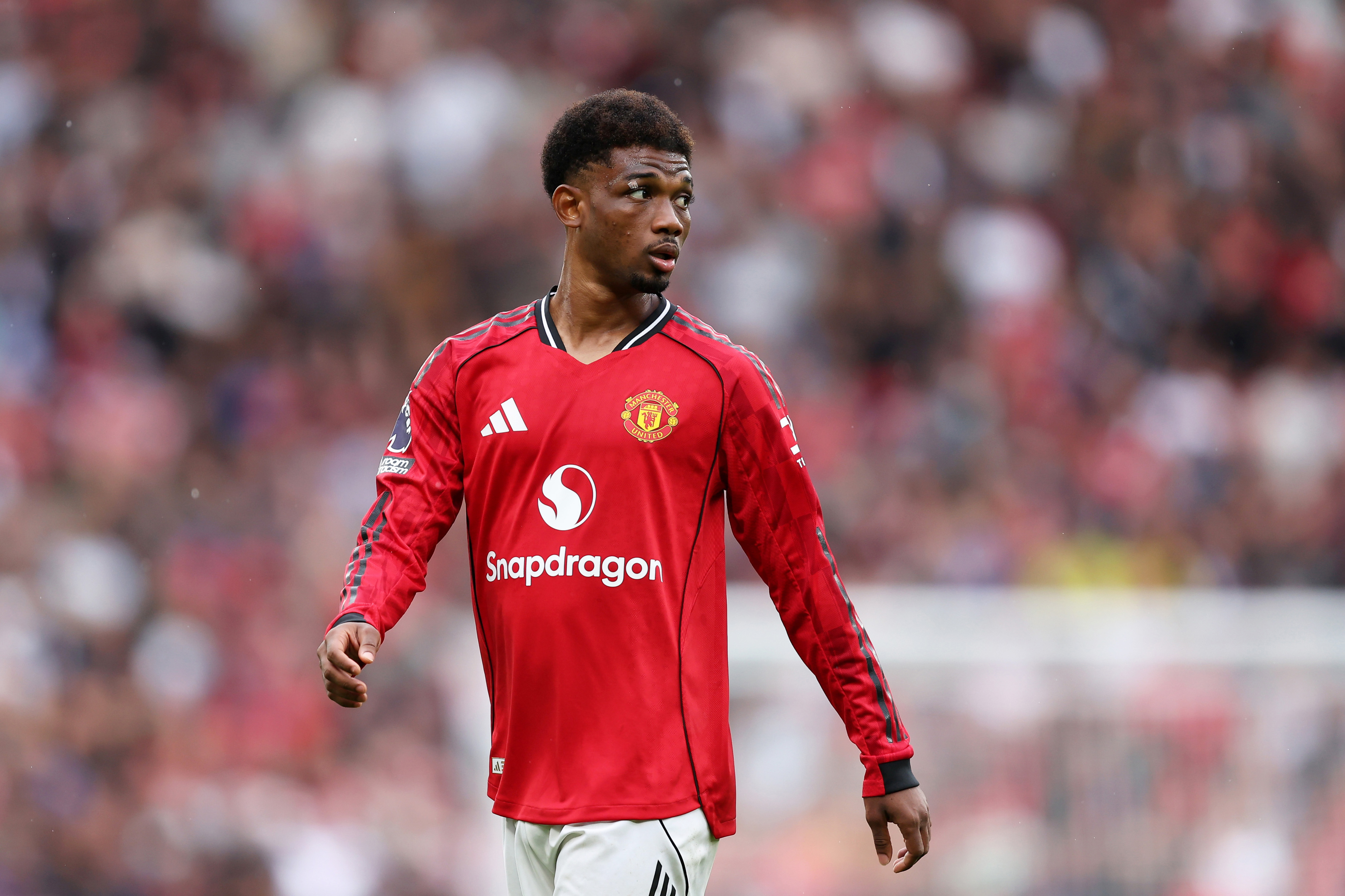 Amad Diallo looks on while in action for Man United at Old Trafford.