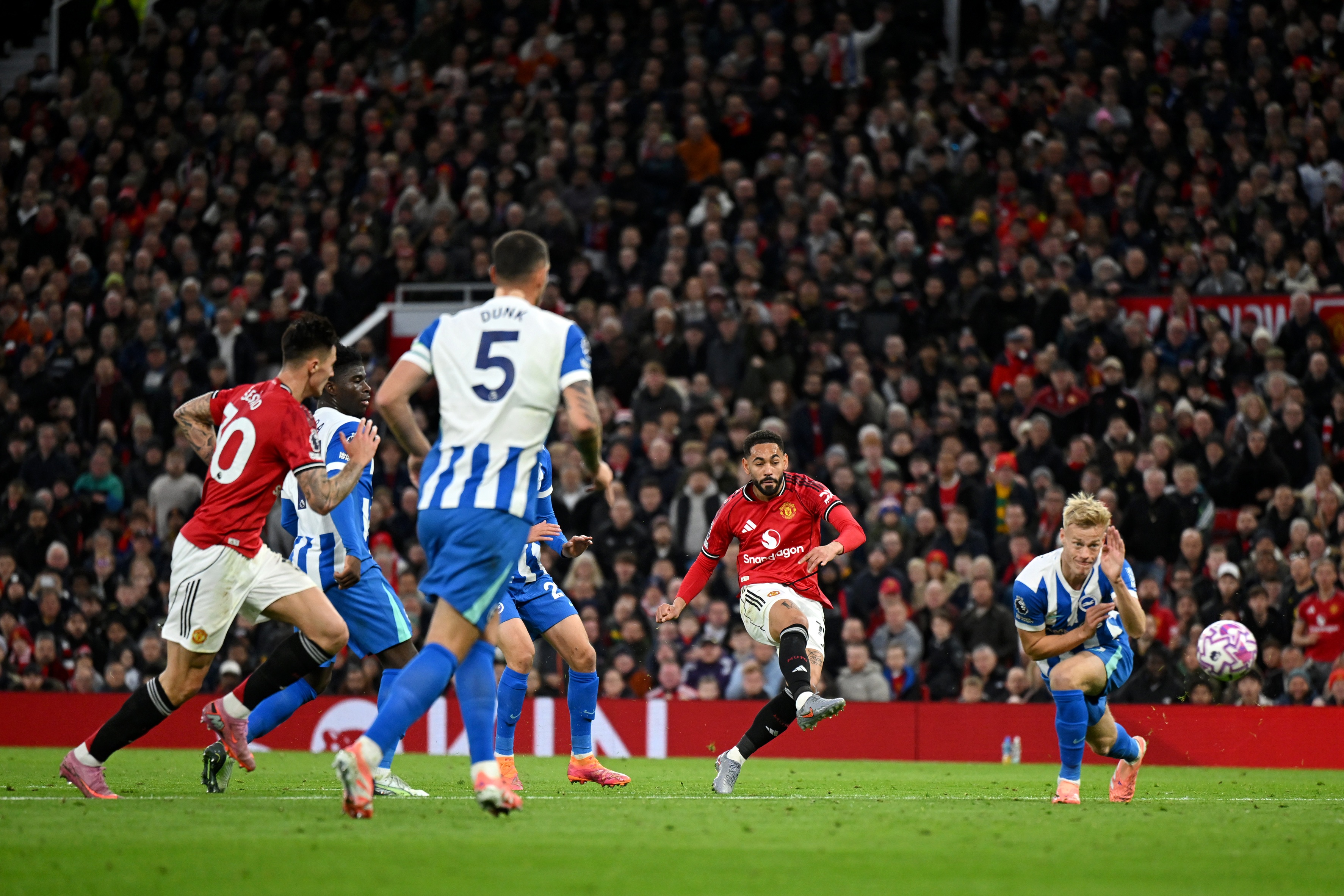 Matheus Cunha fires a shot against Brighton.