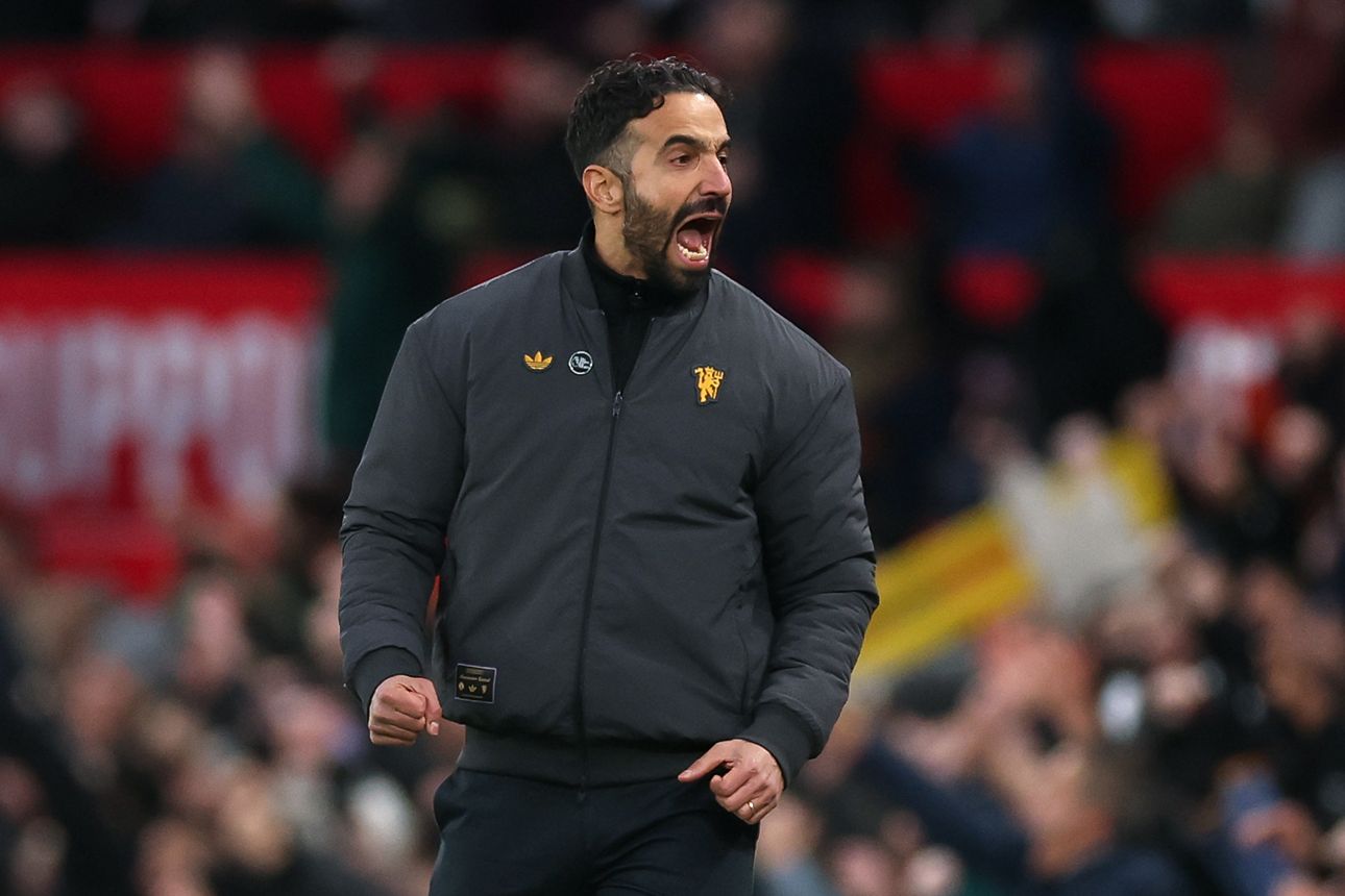 Ruben Amorim screams in celebration during Manchester United game.