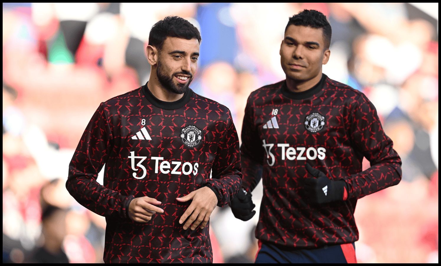 Bruno Fernandes and Casemiro warm up together at Old Trafford.