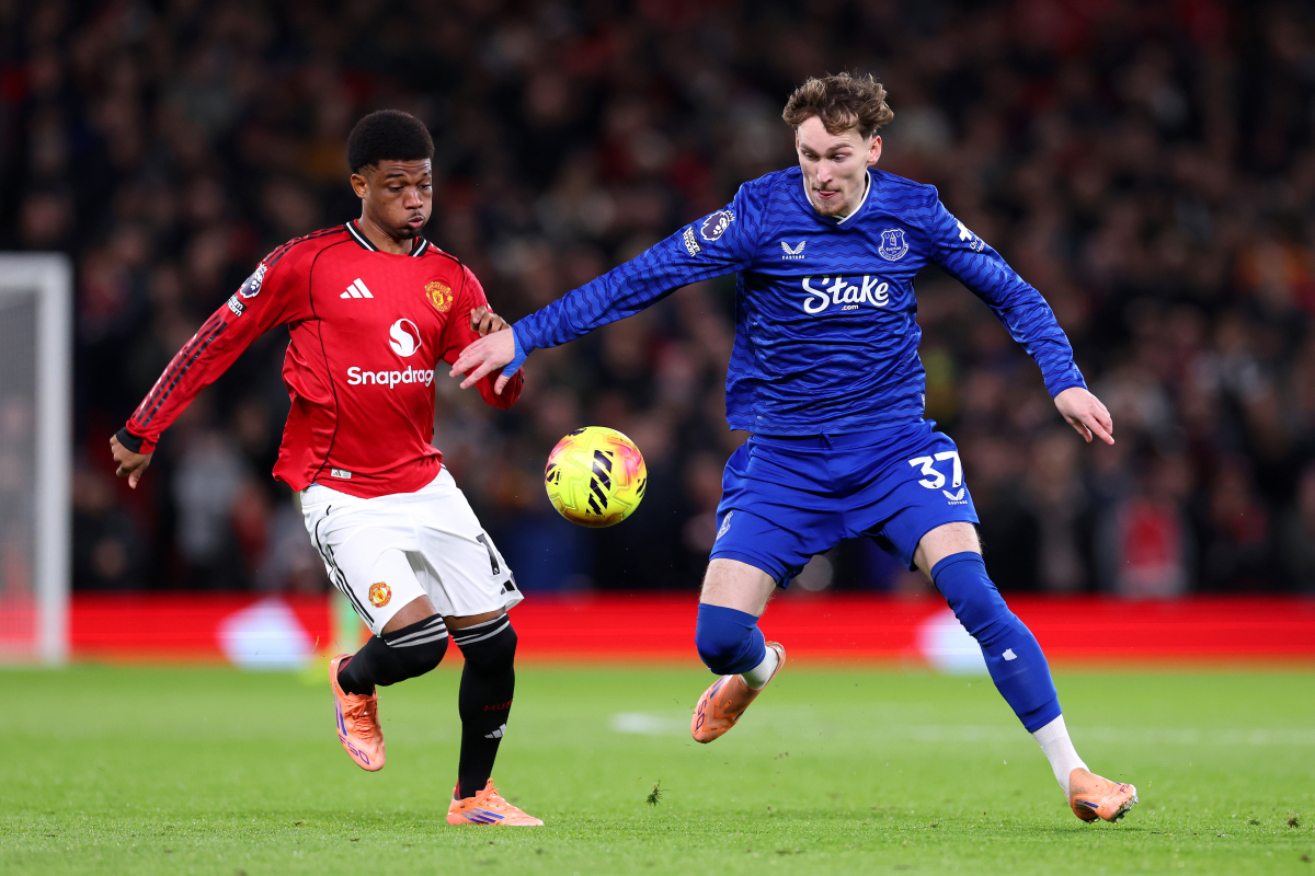 Amad Diallo battles for possession with James Garner.