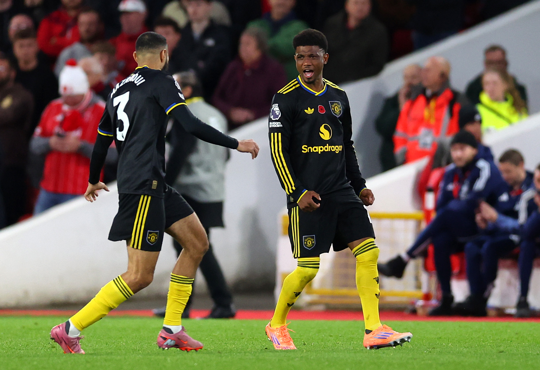 Amad Diallo celebrates scoring against Nottingham Forest with Noussair Mazraoui.
