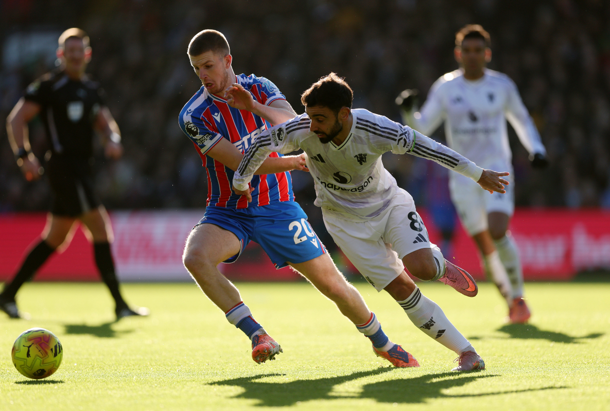 Bruno Fernandes vies for posession with Adam Wharton.