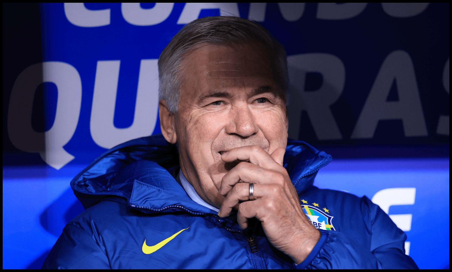 Carlo Ancelotti smiles in the Brazil dugout.